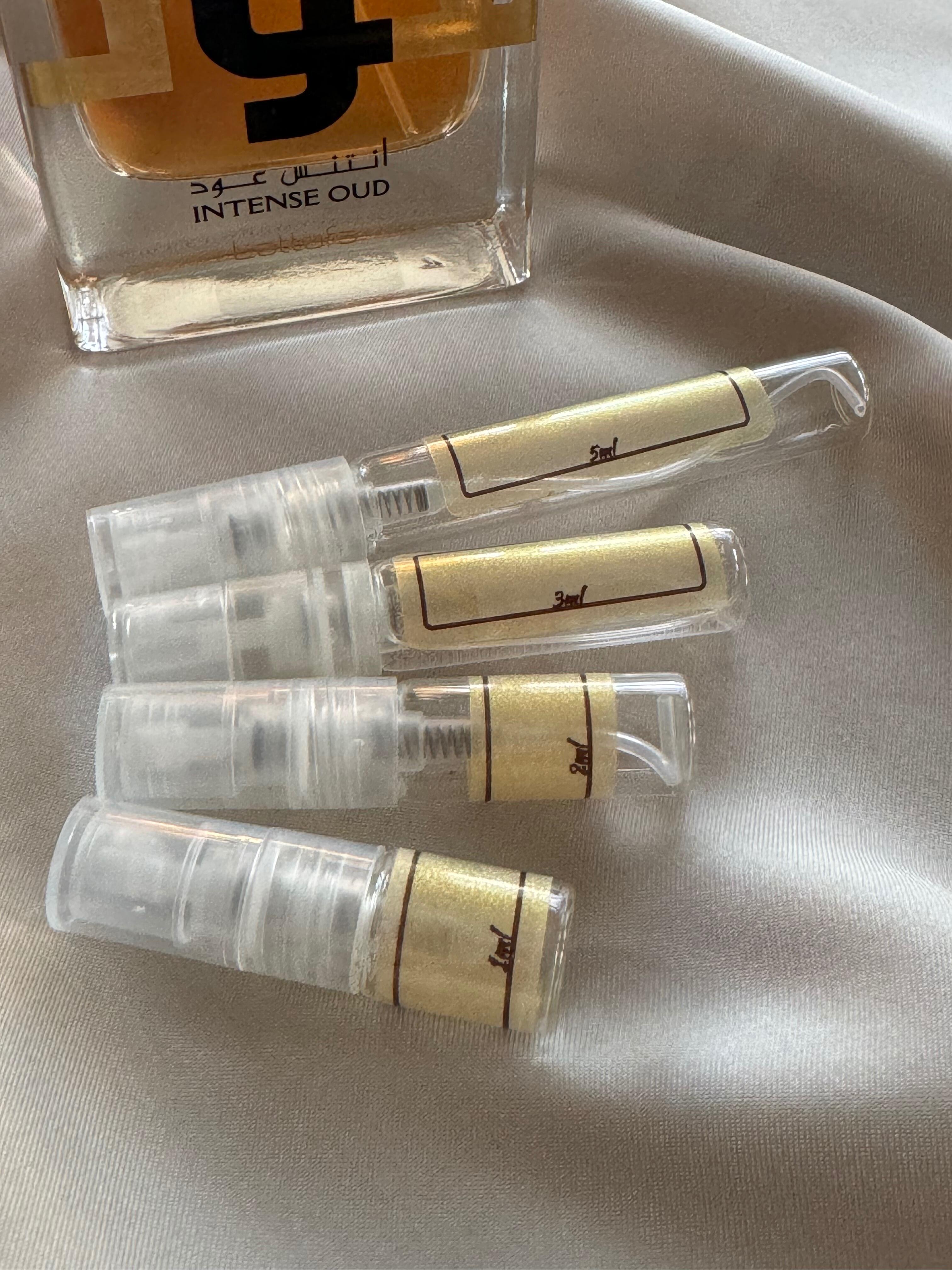 Lattafa - Ameer Al Oudh Intense Oud Perfume bottle with samples