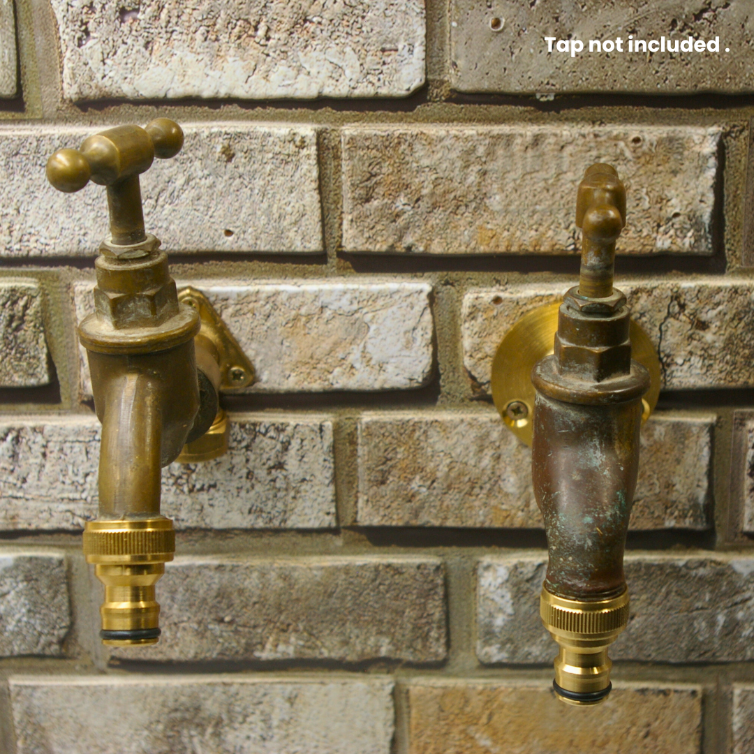 Two vintage brass garden taps on brick wall fitted with 5/8 threaded female tap connectors - ideal for older outside taps