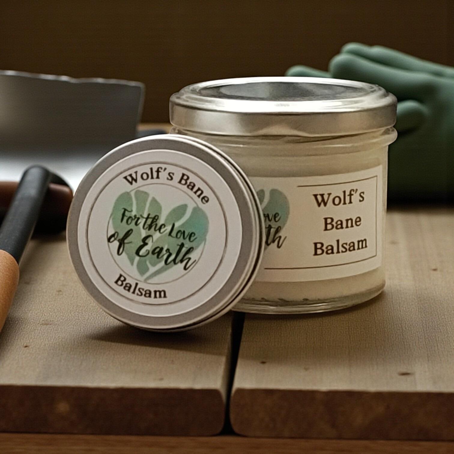 wolfs bane balsam in a glass jar and tin