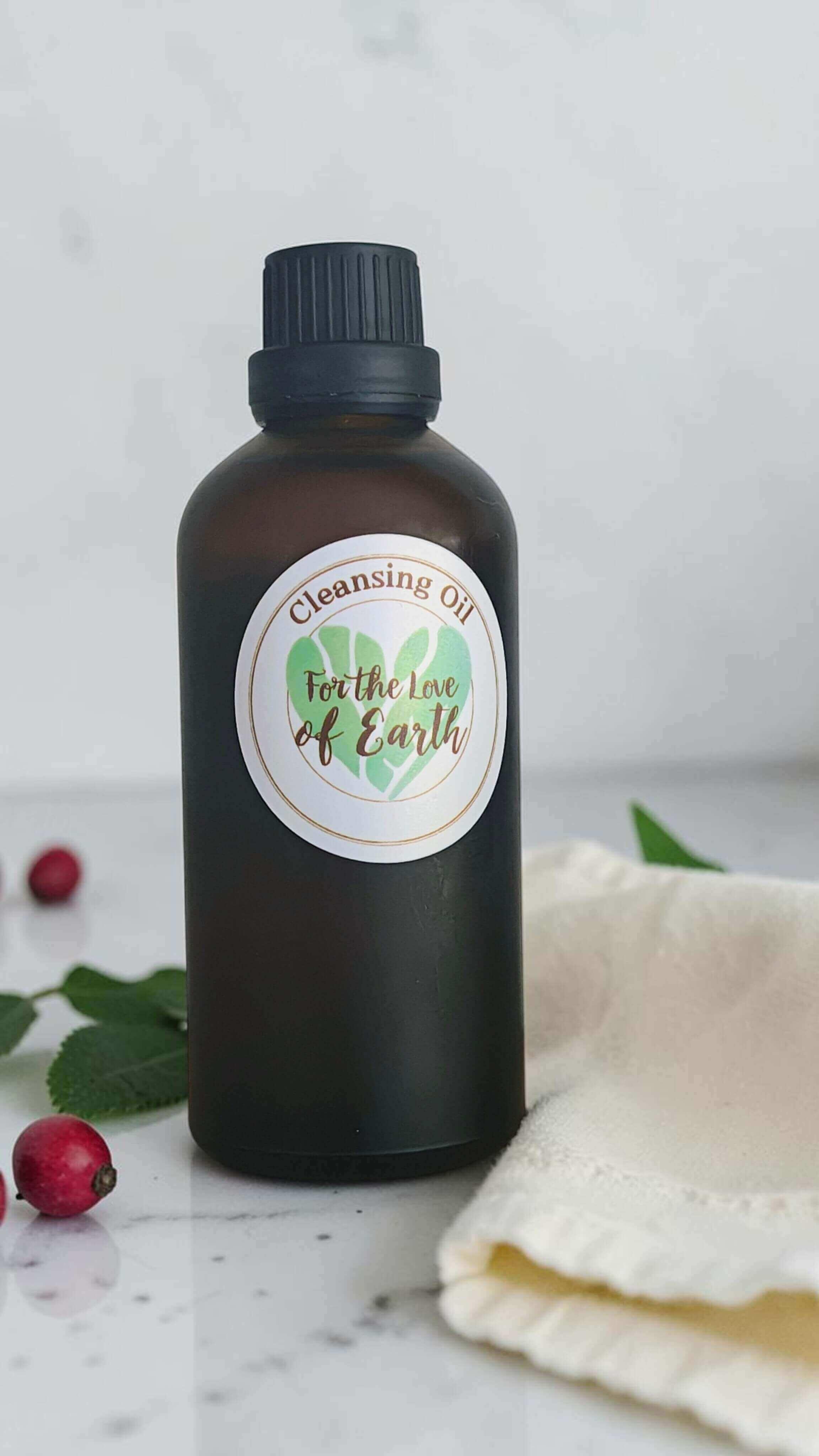 An amber glass bottle containing For the Love of Earth Cleansing oil