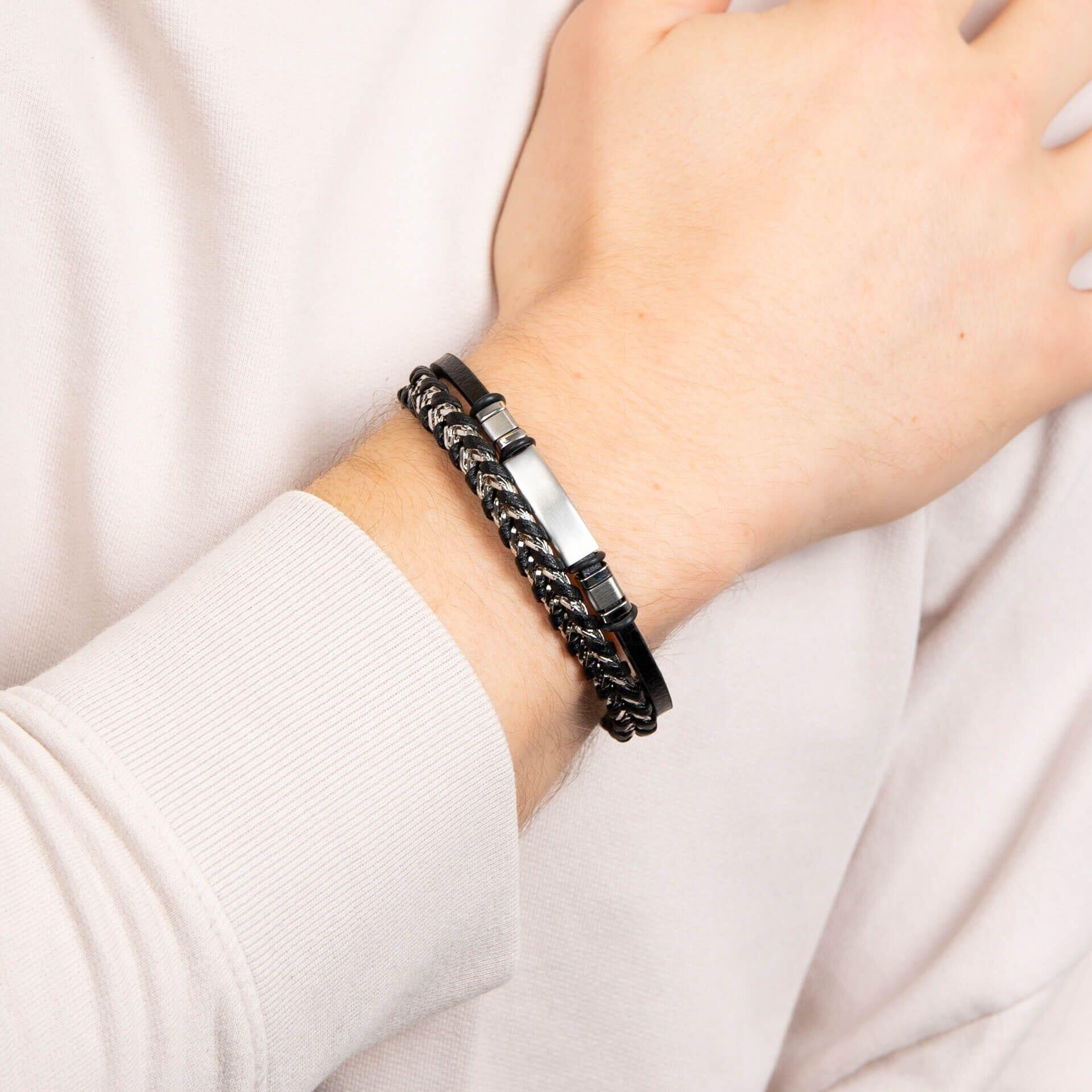 "Black Leather & Stainless Steel ID Bar Bracelet by fredbennett®, featuring a sleek stainless steel ID bar, free engraving service, and AnchorCert Pro certified skin safe, presented in a branded premium suede wallet."