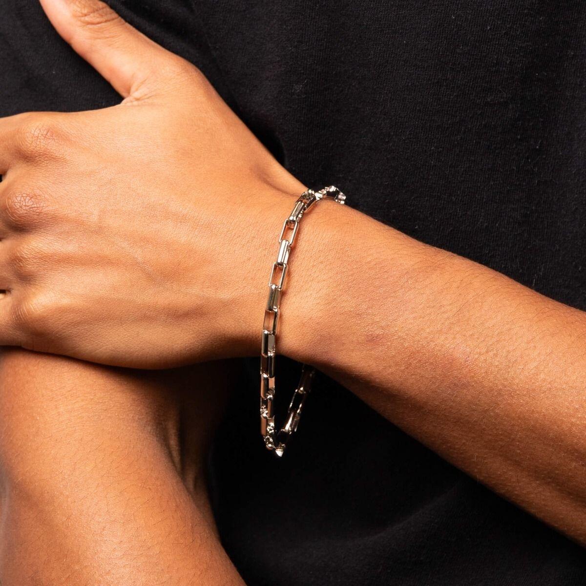 "Platinum Plated Recycled Silver Box Chain Bracelet by fredbennett®, crafted from recycled sterling silver with platinum plating, AnchorCert Pro certified skin safe, 23cm length, presented in a branded premium suede pouch in a branded gift box."