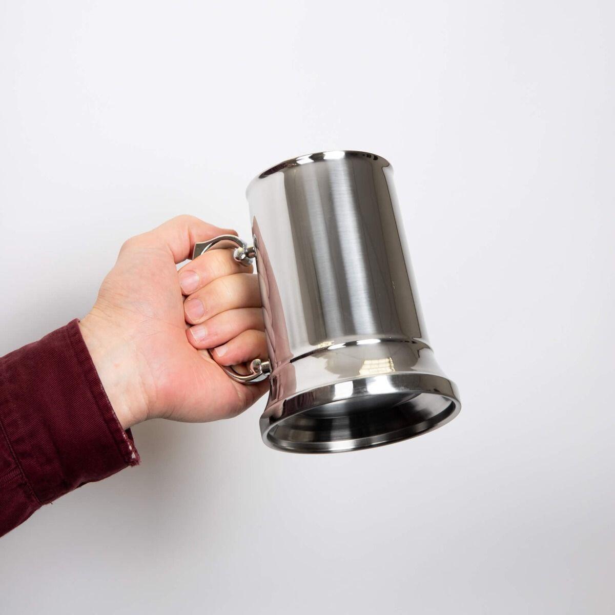 "fredbennett® Personalised Stainless Steel Tankard with zinc alloy handle – a timeless engraved gift for groomsmen, the groom, or any special celebration. Includes free custom engraving, available at Gold and Diamonds."