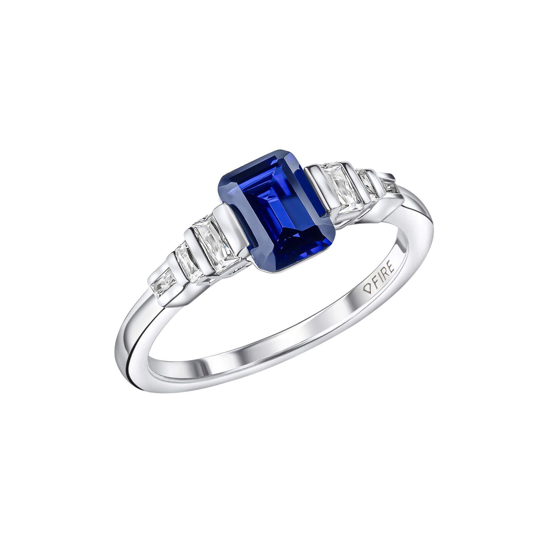 Diamonfire® 1.20ct Emerald Cut Blue Sapphire Zirconia Ring featuring a deep blue centre stone framed by sparkling clear zirconia stones, crafted in triple-plated sterling silver, presented in exclusive silk packaging with a luxury gift box and bag.