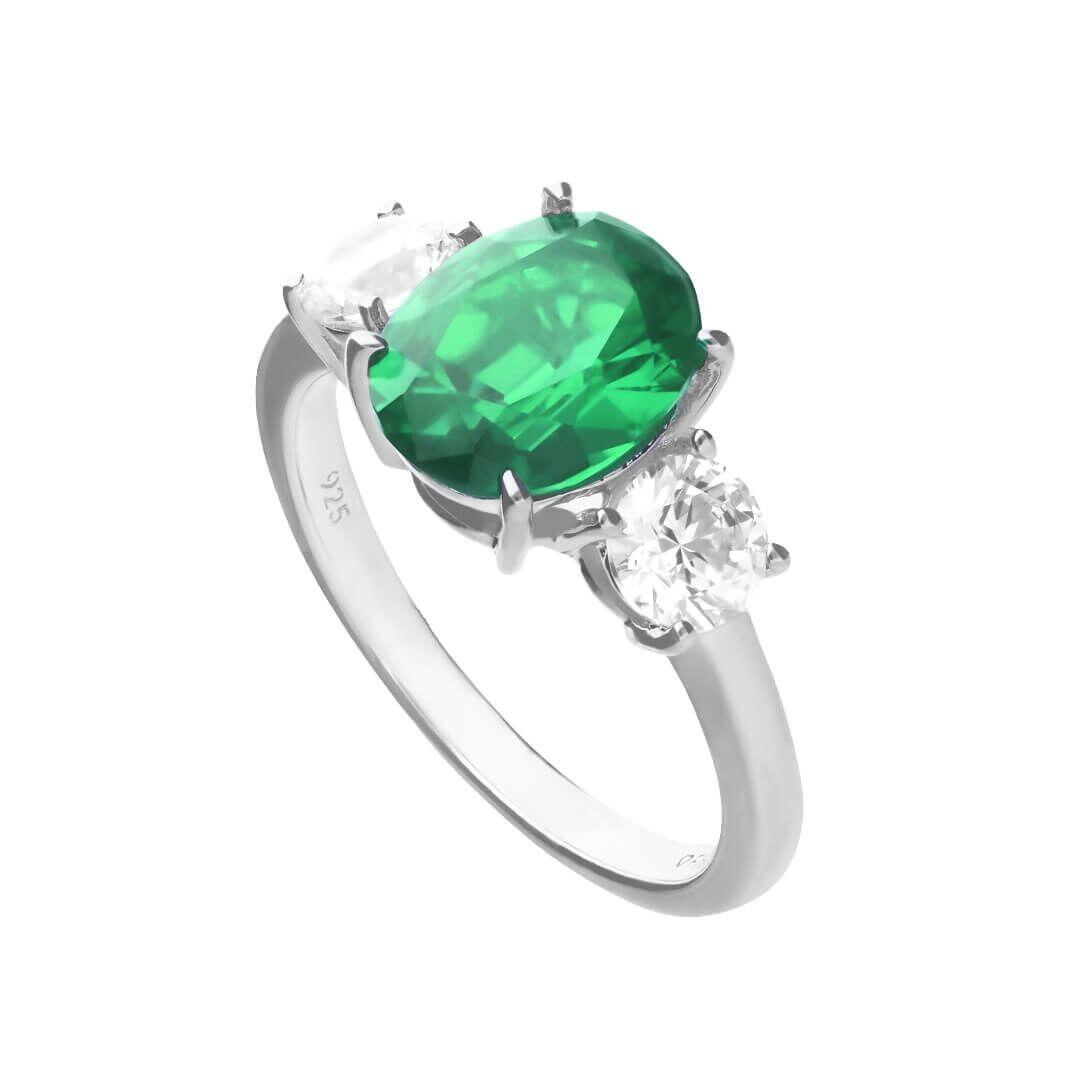 Diamonfire® 5.73ct Green Emerald Oval Zirconia Trilogy Ring featuring a deep green oval centre stone with two clear zirconia accents, crafted in triple-plated sterling silver, presented in exclusive silk packaging with a luxury gift box and bag.