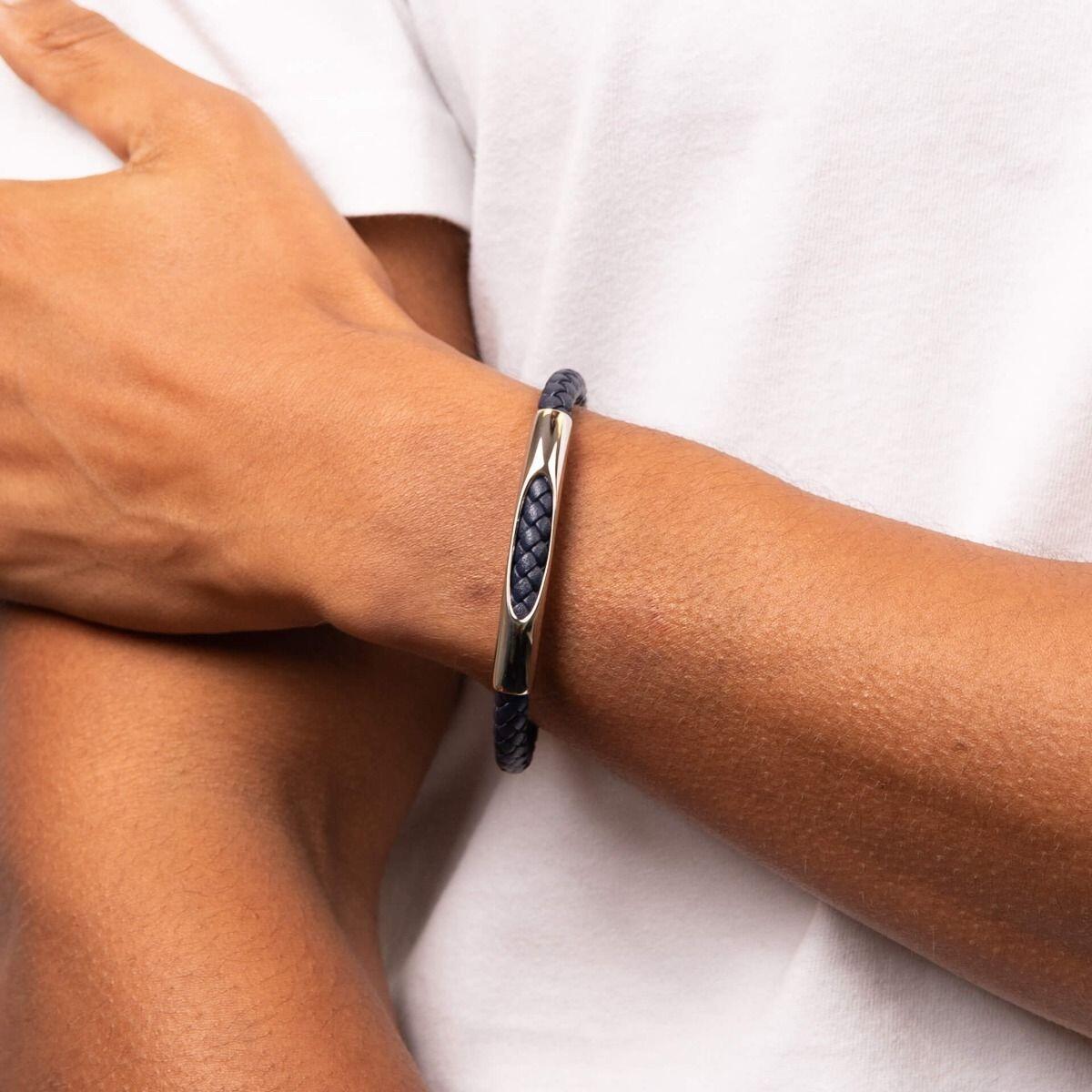 "fredbennett® Navy Blue Woven Leather & Stainless Steel Bracelet – A stylish men’s bracelet crafted from genuine navy blue woven leather, featuring a statement stainless steel front and a secure magnetic clasp. Perfect for everyday wear. AnchorCert® certified and presented in luxury suede packaging from Gold and Diamonds."