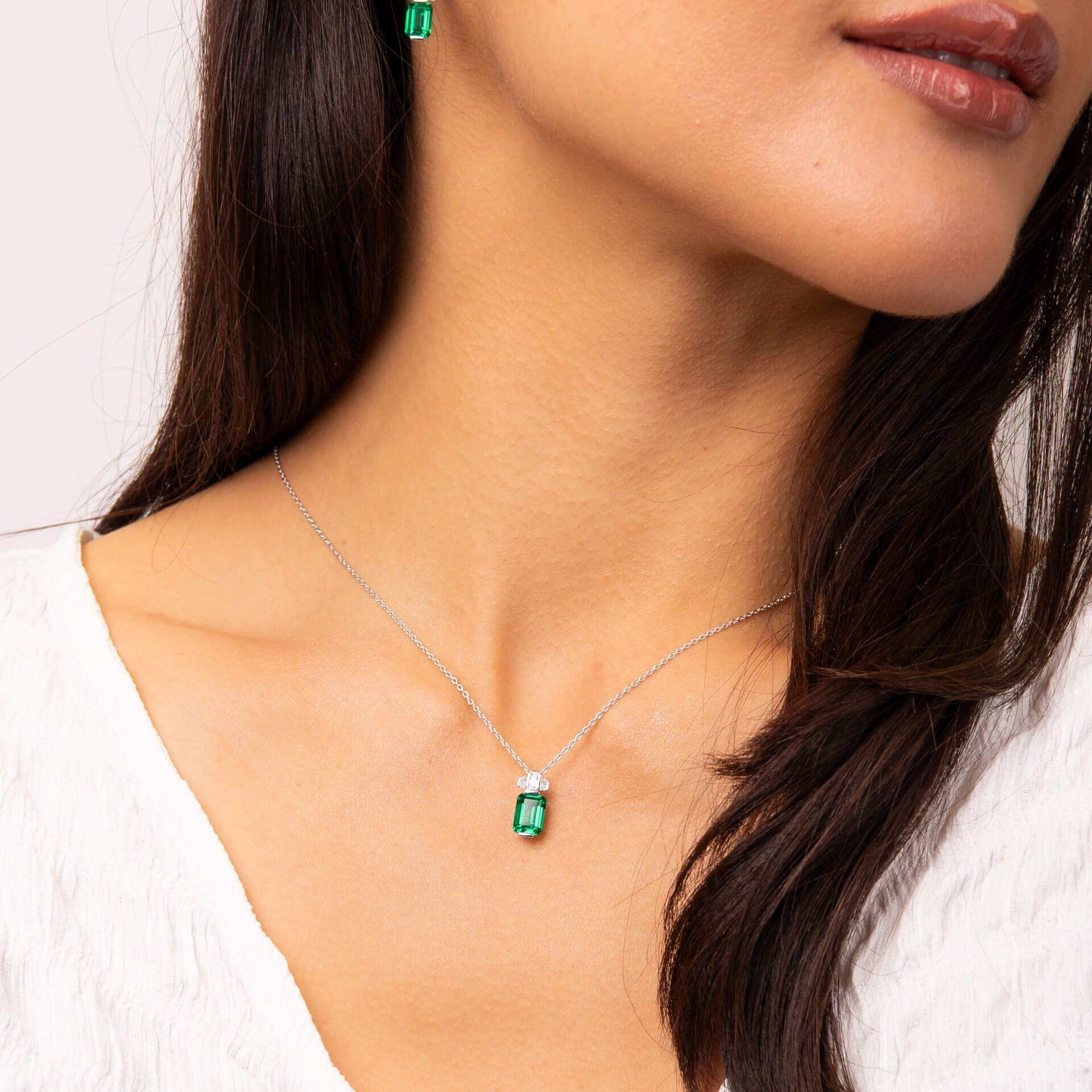 "Diamonfire® Emerald Cut Zirconia Pendant – coloured centre stone with clear halo in triple plated sterling silver. Presented in luxury silk packaging from Gold and Diamonds."