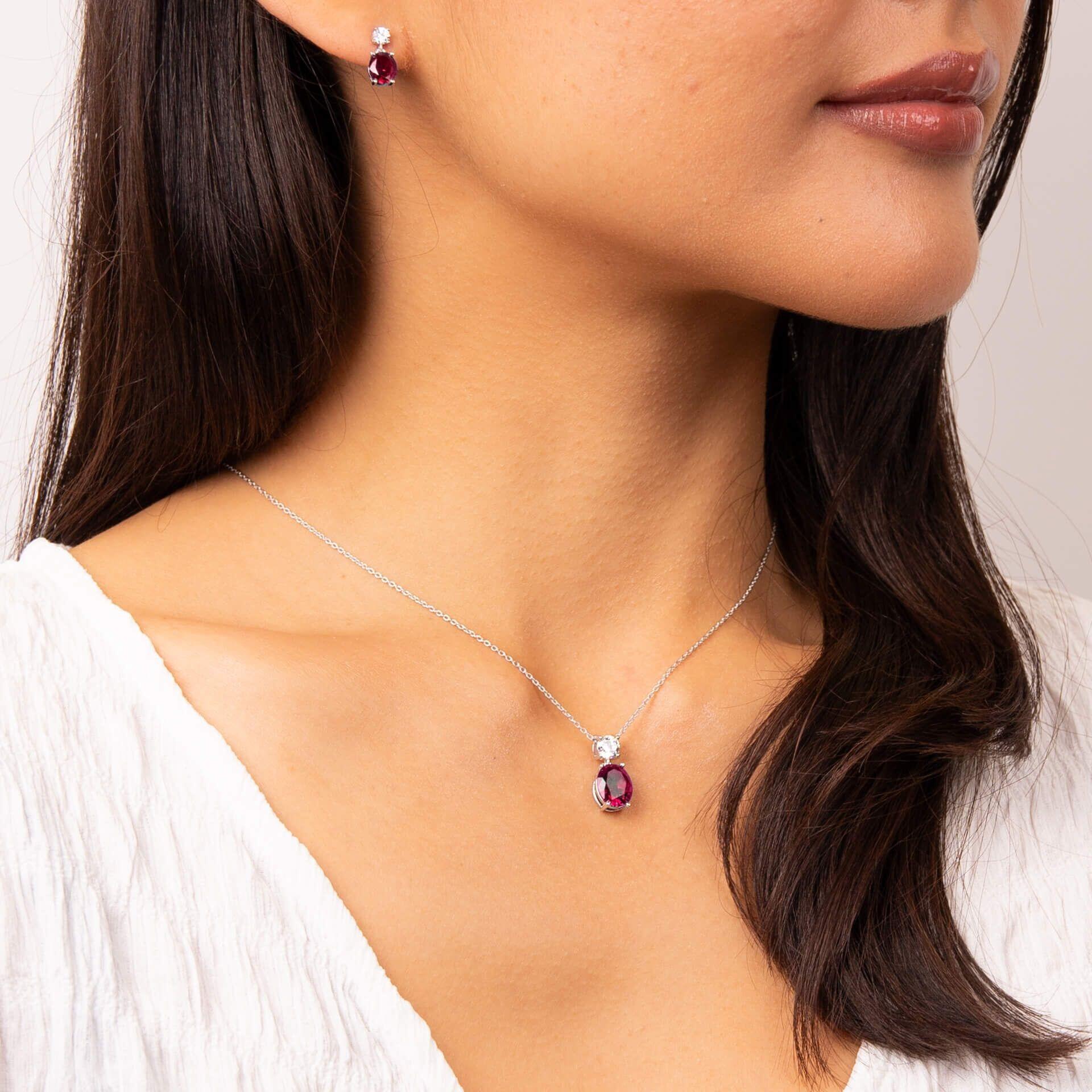 "Diamonfire® Ruby-Coloured Oval Drop Pendant with clear accent zirconia, crafted in triple plated sterling silver, AnchorCert Pro certified skin safe, presented in luxury silk packaging."