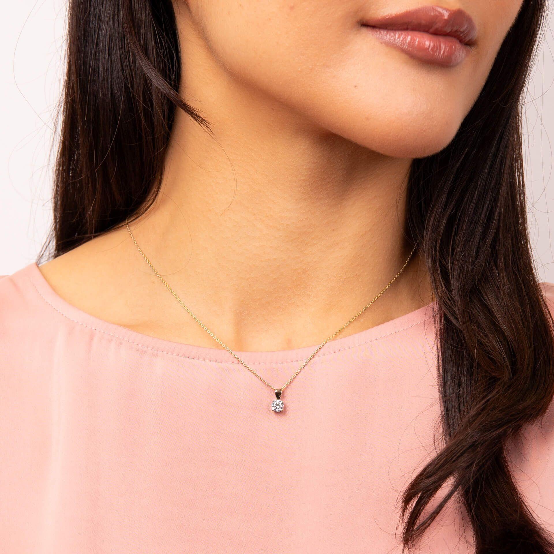 "Diamonfire® Four Claw Solitaire Pendant in 24ct yellow gold plated sterling silver with 57-facet zirconia, AnchorCert Pro certified skin safe, available in multiple carat sizes, presented in luxury silk packaging—perfect for brides and elegant events."