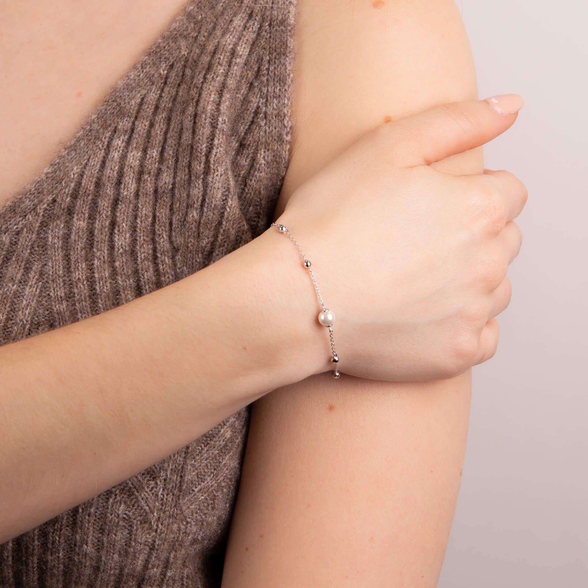 Diamonfire® Station Bracelet with Shell Pearl, featuring tiny ball accents and a 6mm shell pearl, crafted in sterling silver with triple platinum plating for lasting brilliance and skin-safe wear.