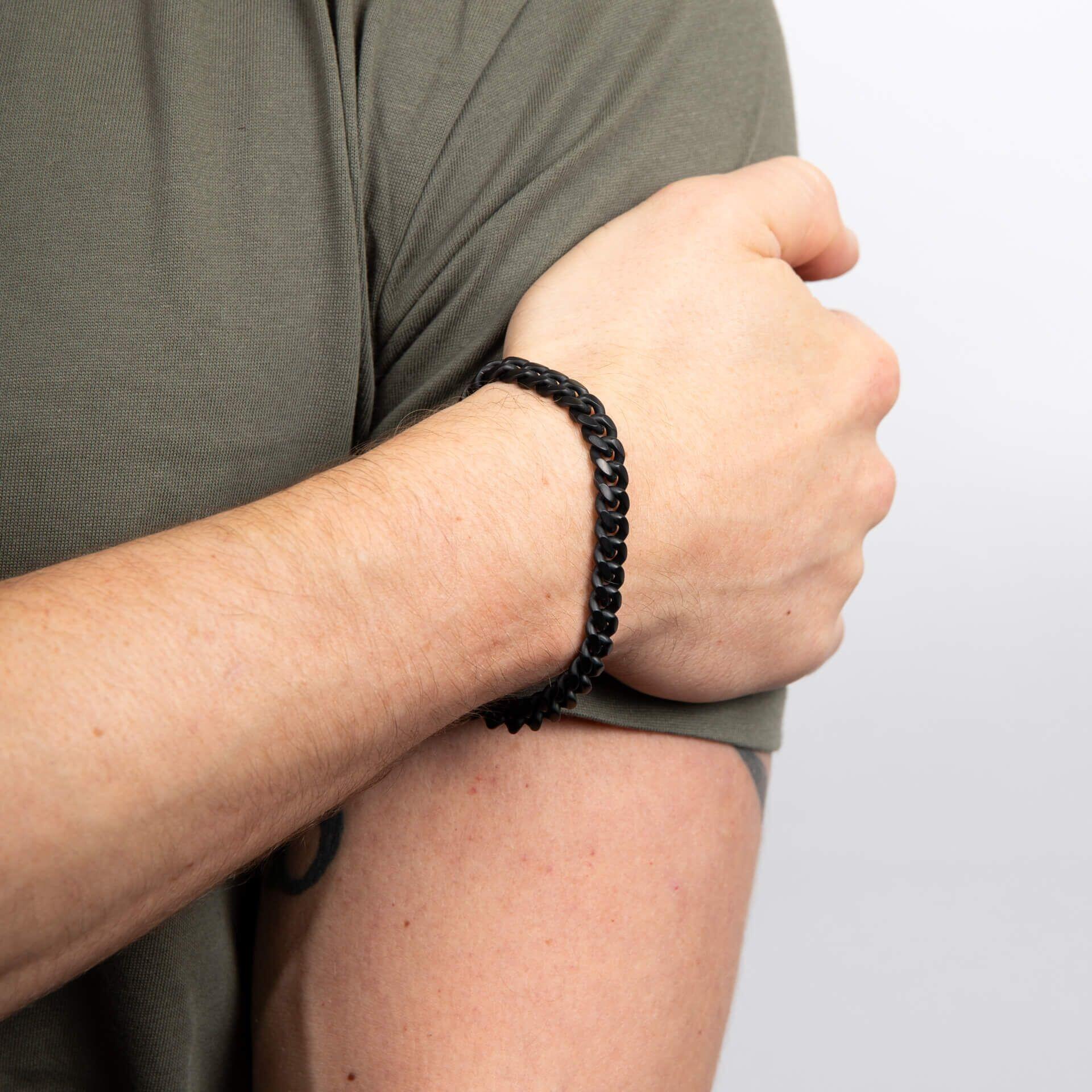 "8mm Black IP Plated Brushed Curb Chain Bracelet by fredbennett®, crafted from durable stainless steel with a bold black IP finish, AnchorCert Pro certified skin safe, presented in a branded premium suede wallet."