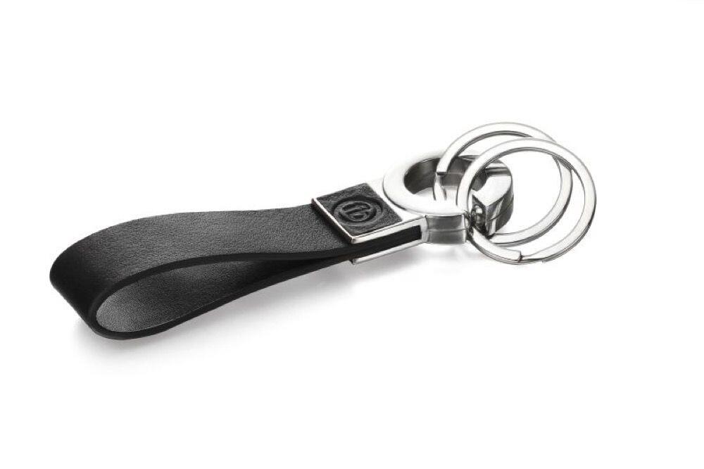 "fredbennett® Double Ring Black Leather Keychain – crafted from sleek leather with a dual ring design and free engraving on the strap or back metal plate. A perfect personal gift for him, available at Gold and Diamonds."