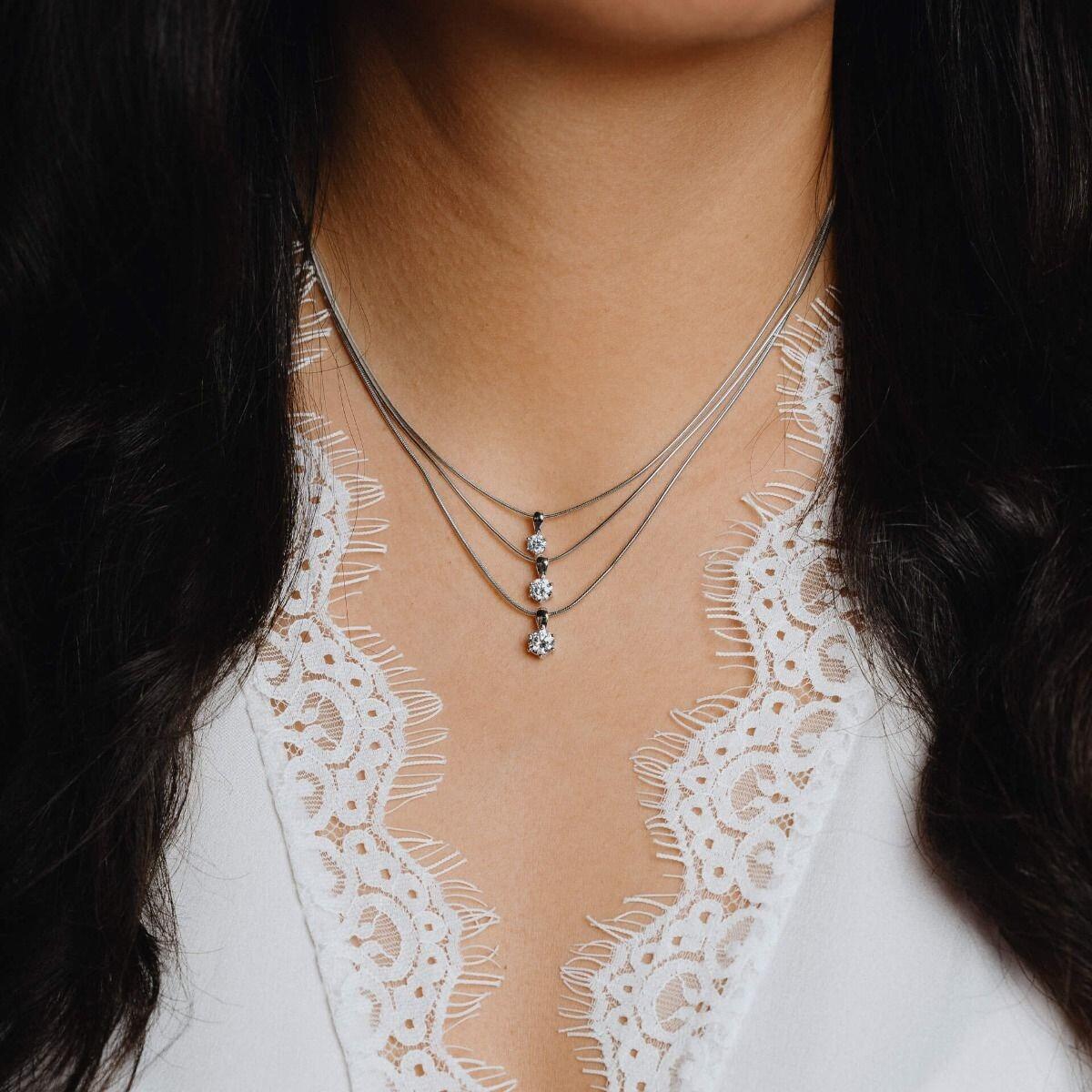 "Diamonfire® Six Claw Solitaire Pendant with 57-facet zirconia stone, available in 0.25ct to 2.00ct, crafted in triple plated sterling silver, AnchorCert Pro certified skin safe, presented in luxury silk packaging with gift bag—ideal for weddings and elegant gifting."
