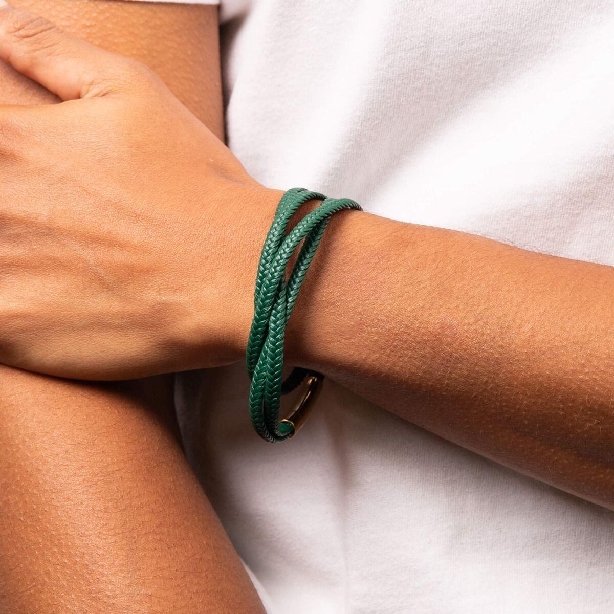 "fredbennett® Multi-Row Plaited Green Recycled Leather Bracelet – A stylish and sustainable men’s bracelet crafted from plaited green recycled leather, designed to wrap around the wrist twice, secured with a yellow gold-plated stainless steel clasp. AnchorCert® certified and presented in luxury suede packaging from Gold and Diamonds."
