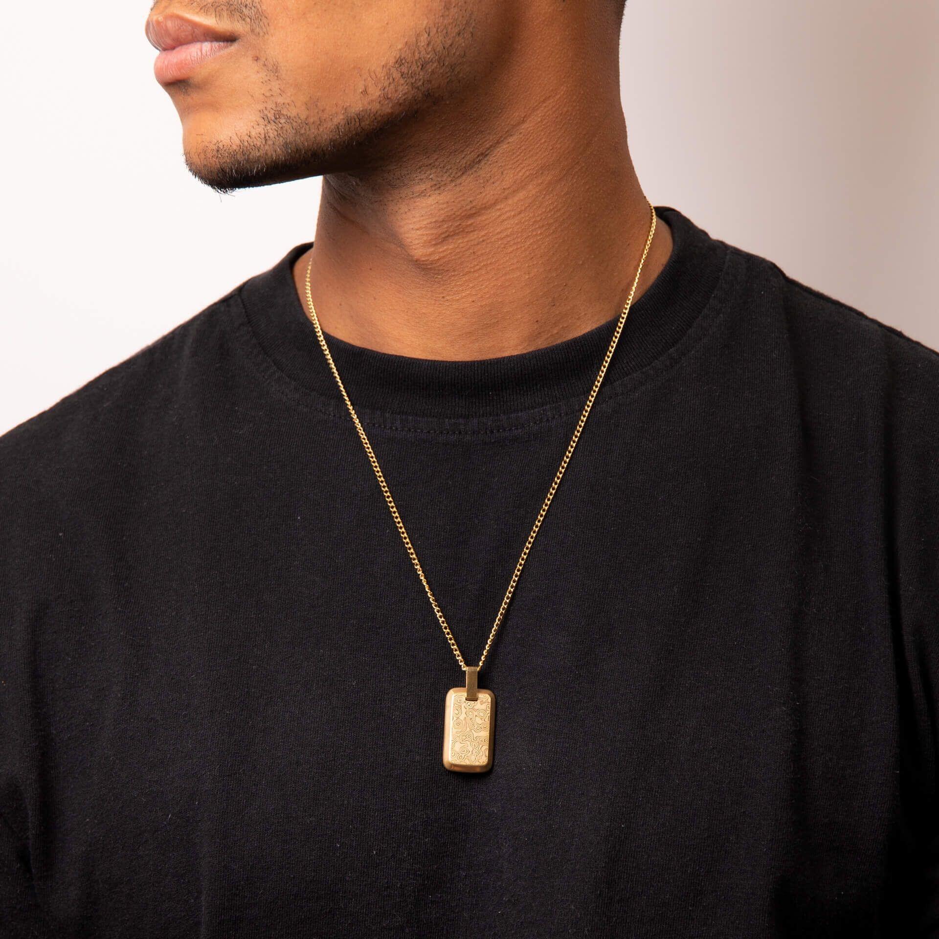 "fredbennett® Yellow Gold IP Damascus Steel Rectangle Pendant and Chain – men’s textured necklace with layered grain pattern, not suitable for engraving. Presented in a suede pouch from Gold and Diamonds."