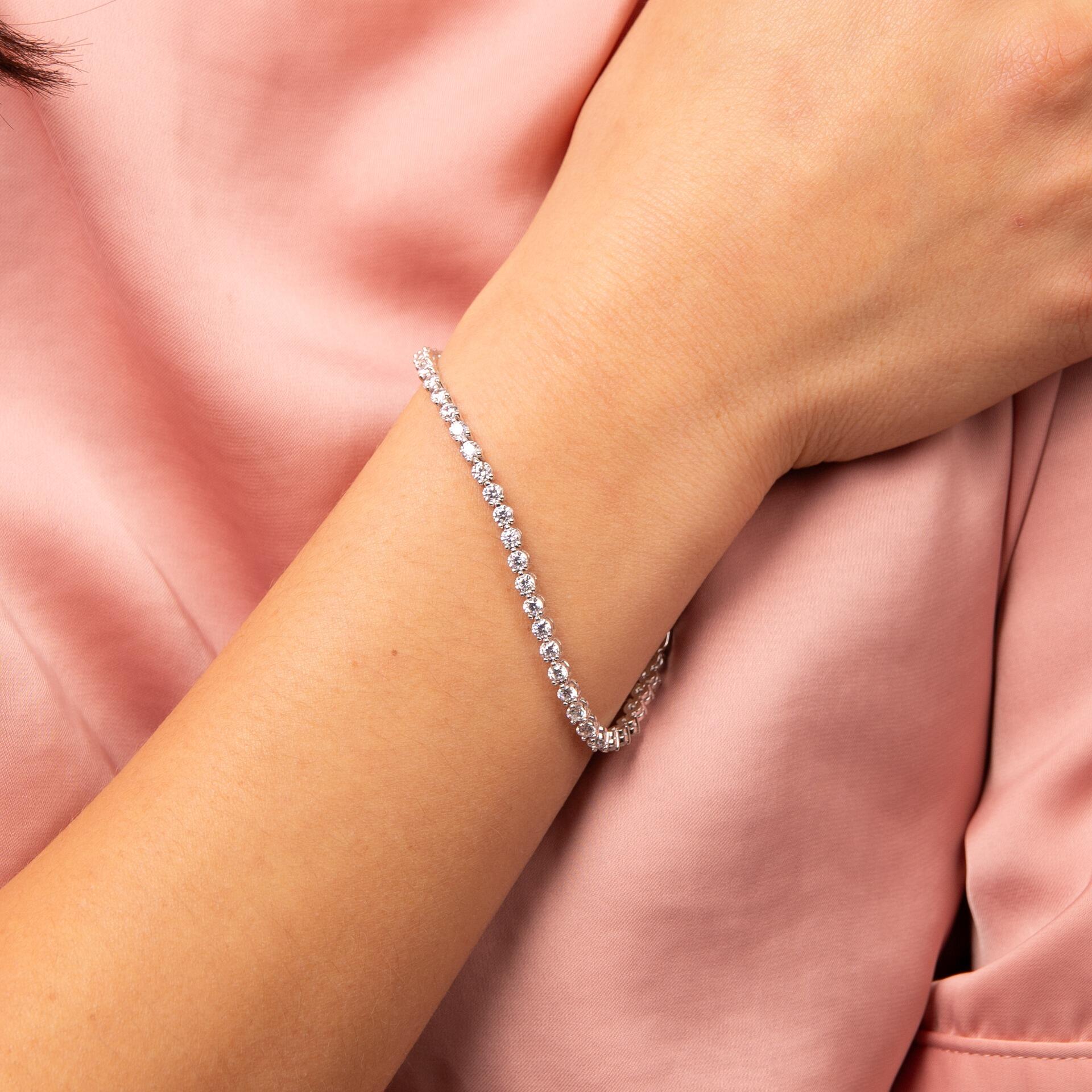 Diamonfire Wristwear for Her – Featuring bracelets, bangles, and cuffs set with diamond-like zirconia and crafted in sterling silver with triple plating, all presented in luxurious silk packaging.