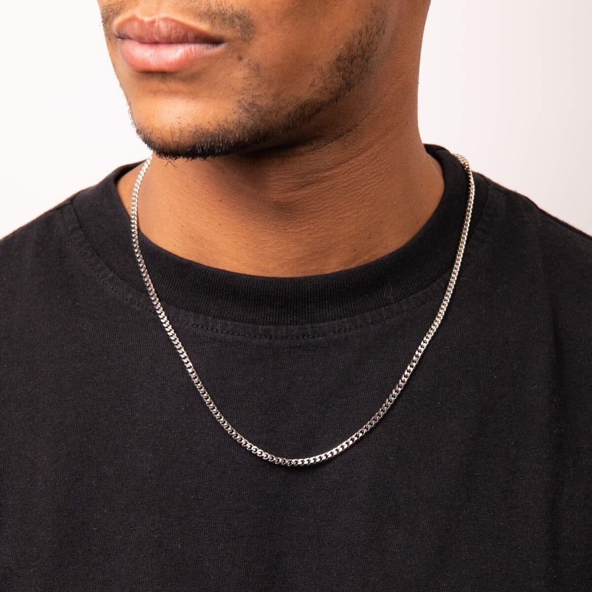 "fredbennett® Diamond Cut Stainless Steel Curb Chain Necklace – 55cm men’s chain with polished finish and light-reflecting links, presented in a suede pouch from Gold and Diamonds."