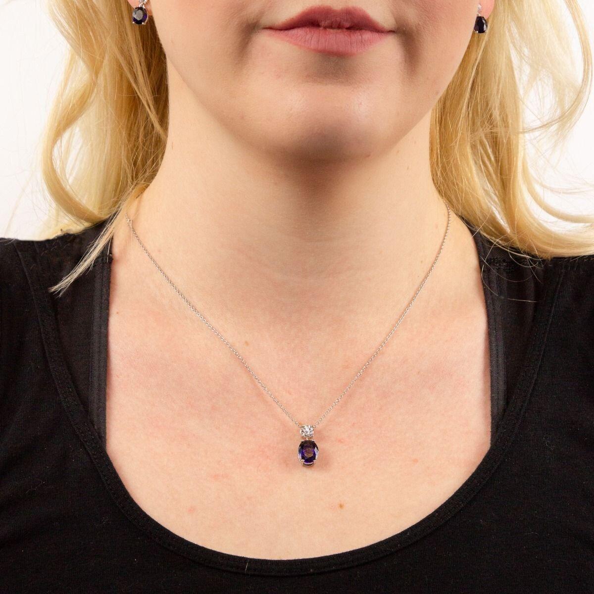 "Diamonfire® Sapphire-Coloured Oval Drop Pendant with clear accent zirconia, crafted in triple plated sterling silver, AnchorCert Pro certified skin safe, presented in luxury silk packaging—perfect for weddings and elegant events."