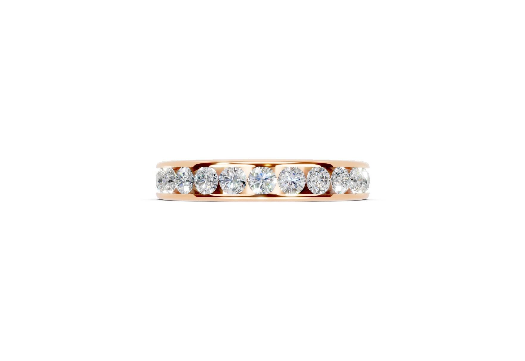 3.7mm channel set diamond wedding ring with 0.75ct round diamonds, 50% set for added sparkle. Available in gold, platinum and palladium. Natural G/VS or lab D/VVS1 diamonds. Free home consultations.