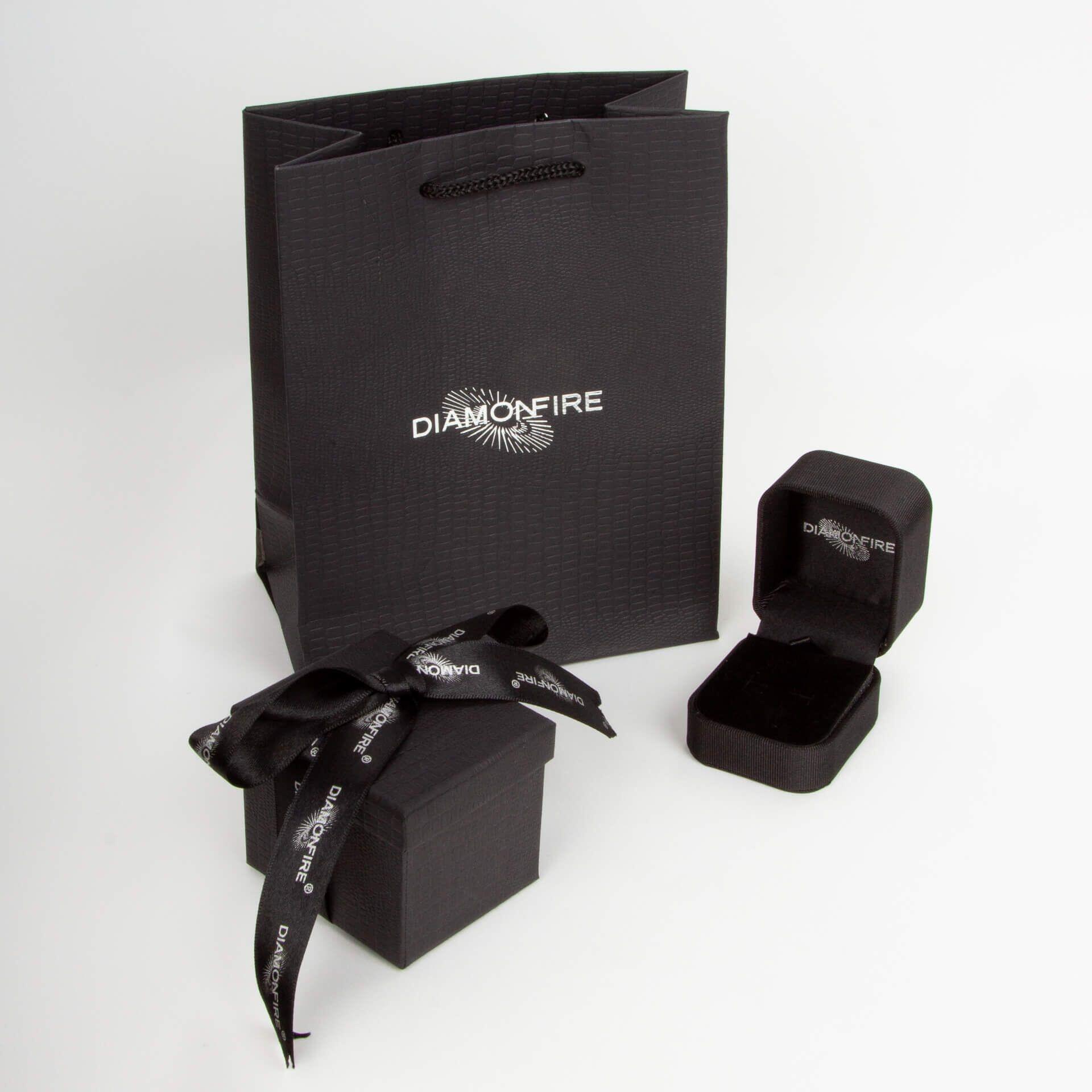 Diamonfire® 2.56ct Pear Cut Emerald Zirconia Ring featuring a rich green centre stone with pave-set clear zirconia stones, crafted in triple-plated sterling silver, presented in exclusive silk packaging with a luxury gift box and bag.