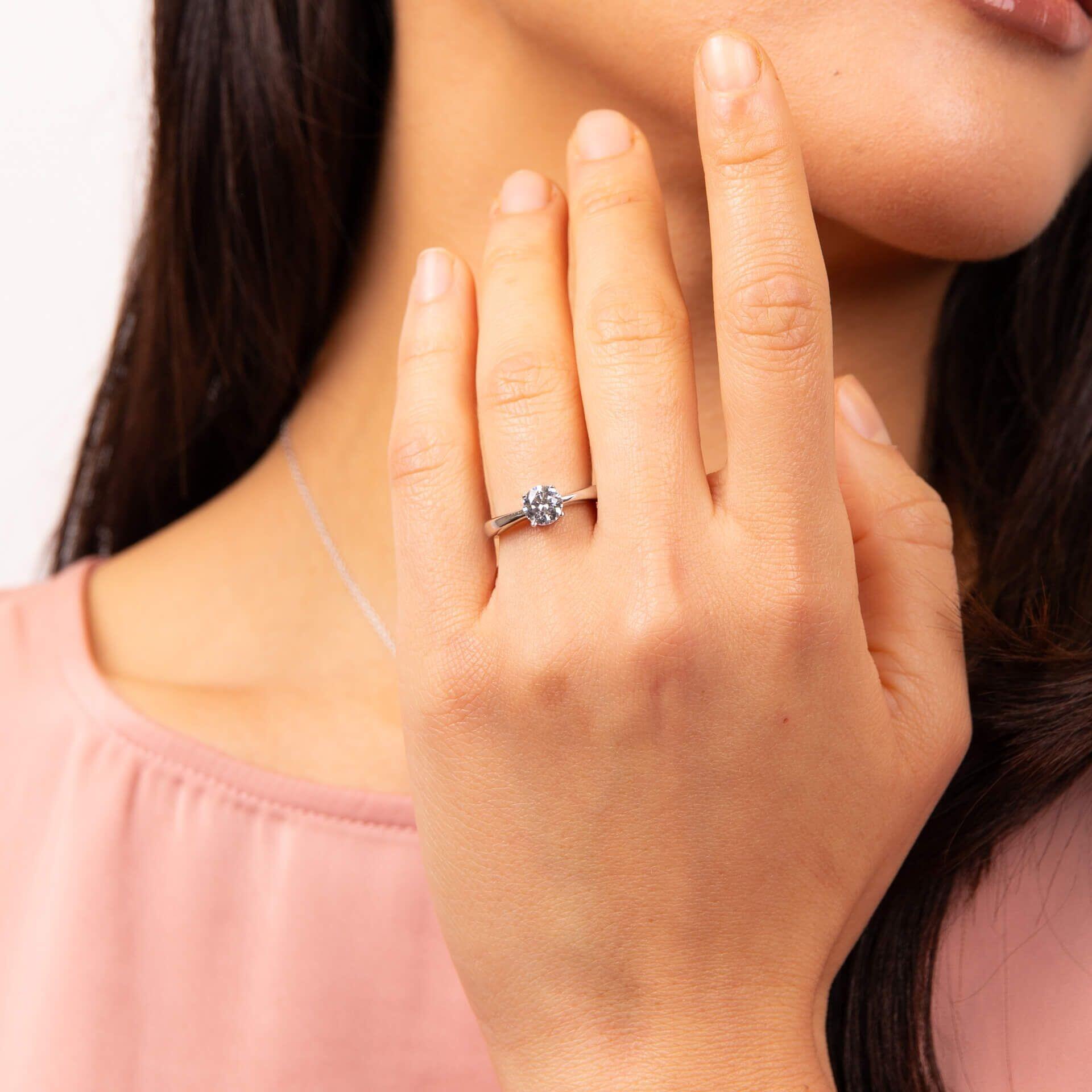 Diamonfire® 1ct Solitaire Ring with 4 Claw Setting in Sterling Silver, available in Platinum or 24K Gold Plated Triple Finish, presented in exclusive Diamonfire® silk packaging with a luxury gift box and bag.