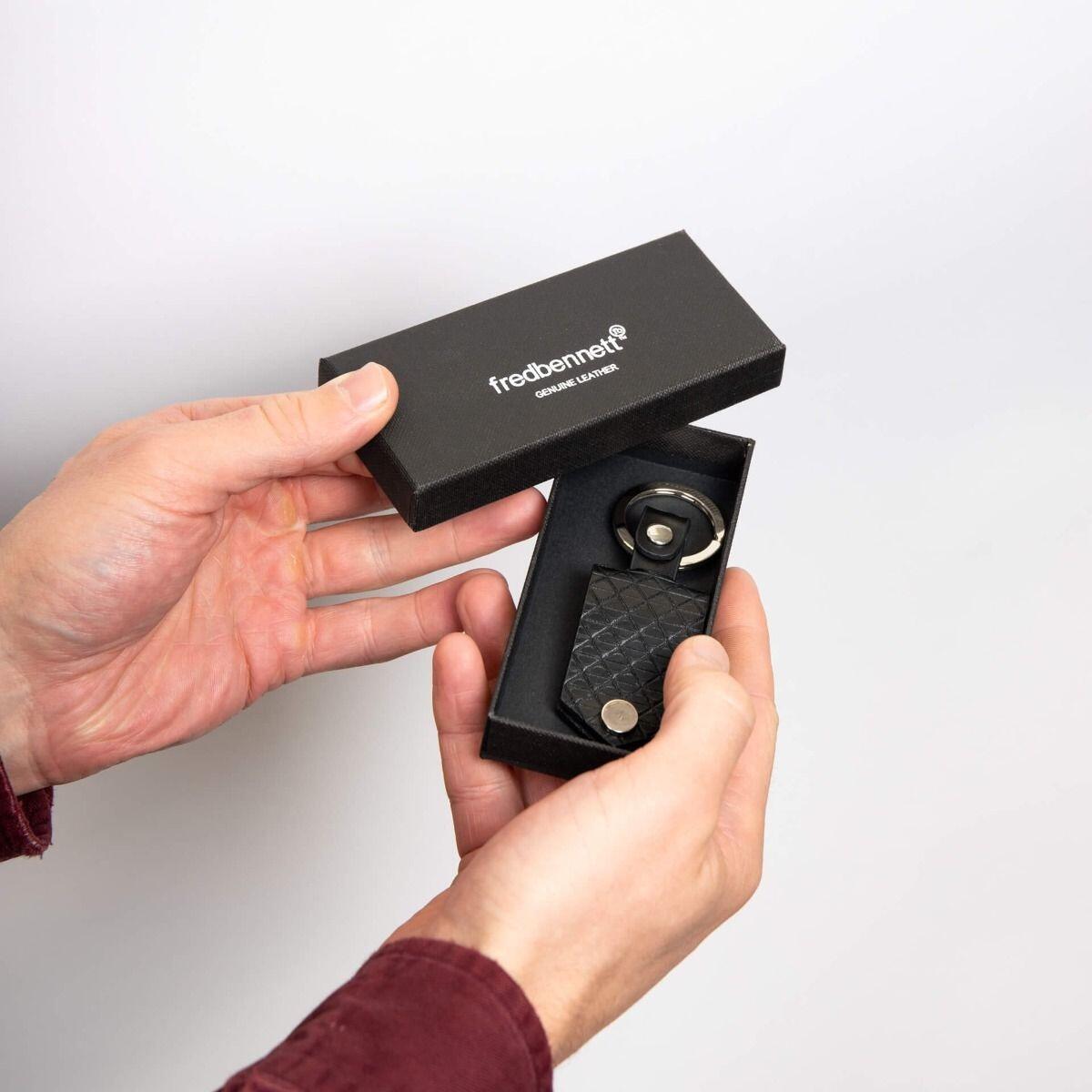 "fredbennett® Black Leather Keyring with engravable stainless steel tag – a sleek, personal gift for him. Customise it with free engraving and pair it with a matching wallet for the perfect set. Available at Gold and Diamonds."