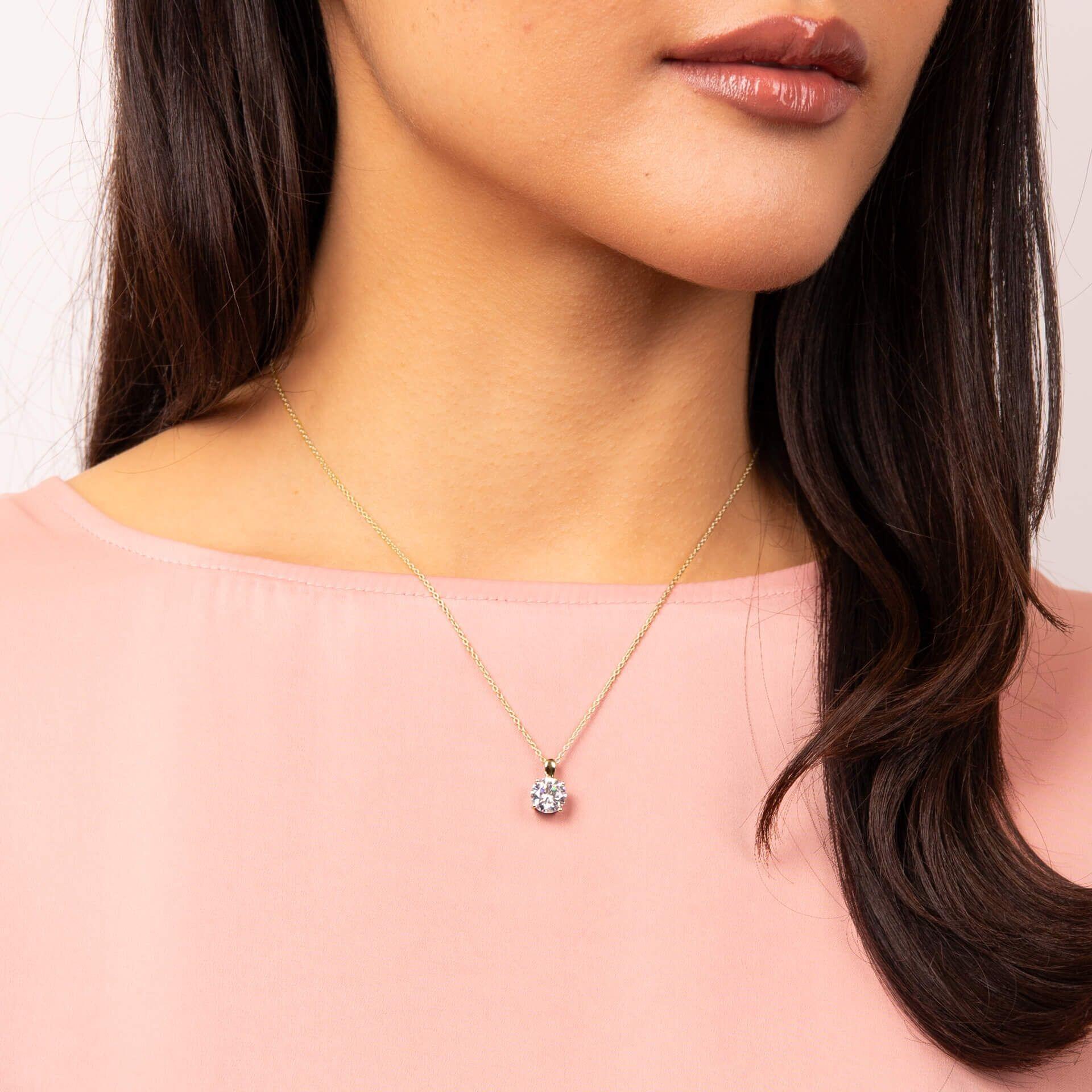 "Diamonfire® Four Claw Solitaire Pendant in 24ct yellow gold plated sterling silver with 57-facet zirconia, AnchorCert Pro certified skin safe, available in multiple carat sizes, presented in luxury silk packaging—perfect for brides and elegant events."