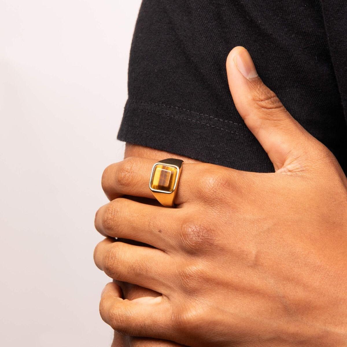 "Stainless Steel Signet Ring with yellow gold IP finish and natural yellow tiger eye, AnchorCert Pro certified skin safe, by fredbennett®, paired with matching dog tag necklace."