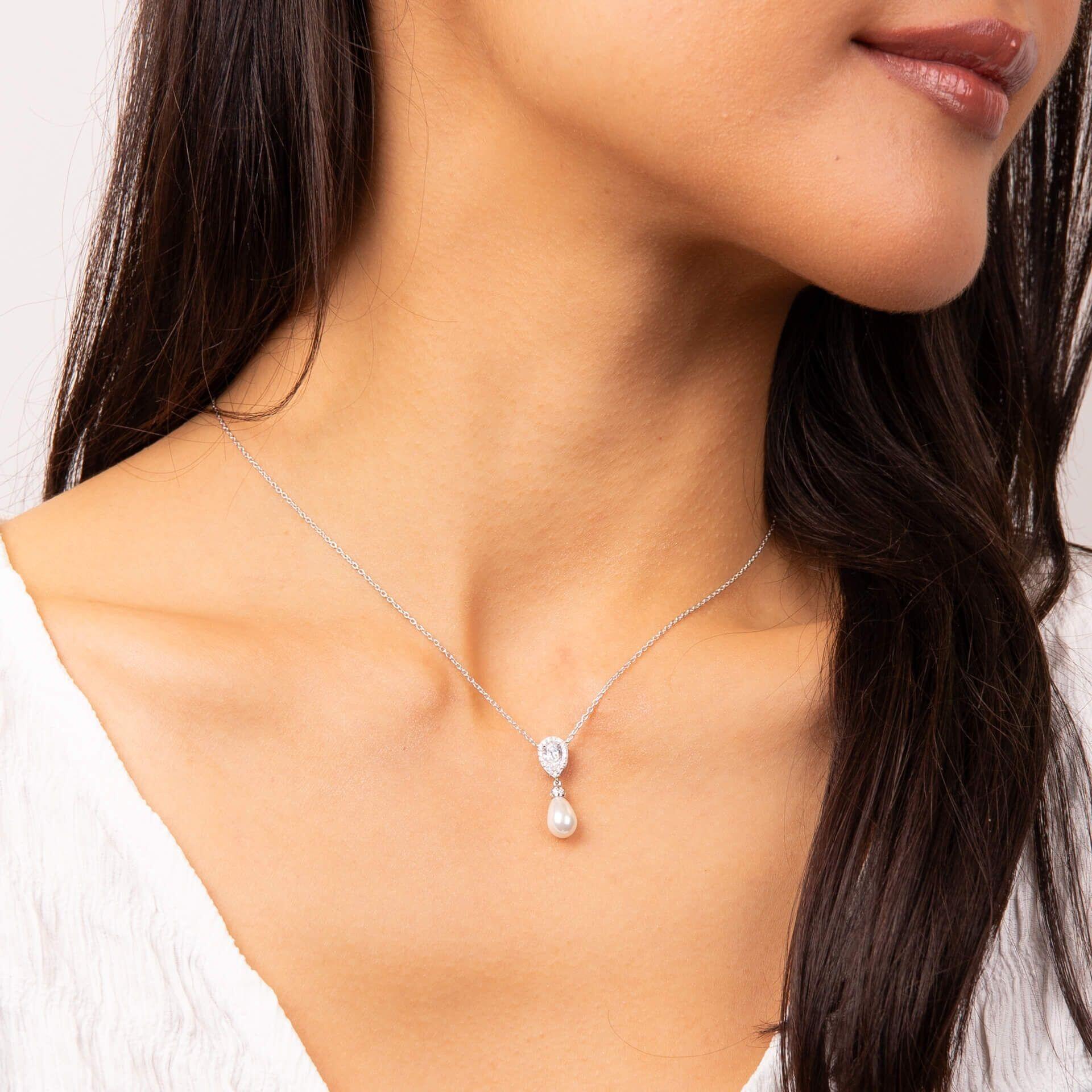 "Diamonfire® Teardrop Pendant with 57-facet zirconia stones and a natural white shell pearl drop, crafted in triple plated sterling silver, AnchorCert Pro certified skin safe, presented in luxury silk packaging."