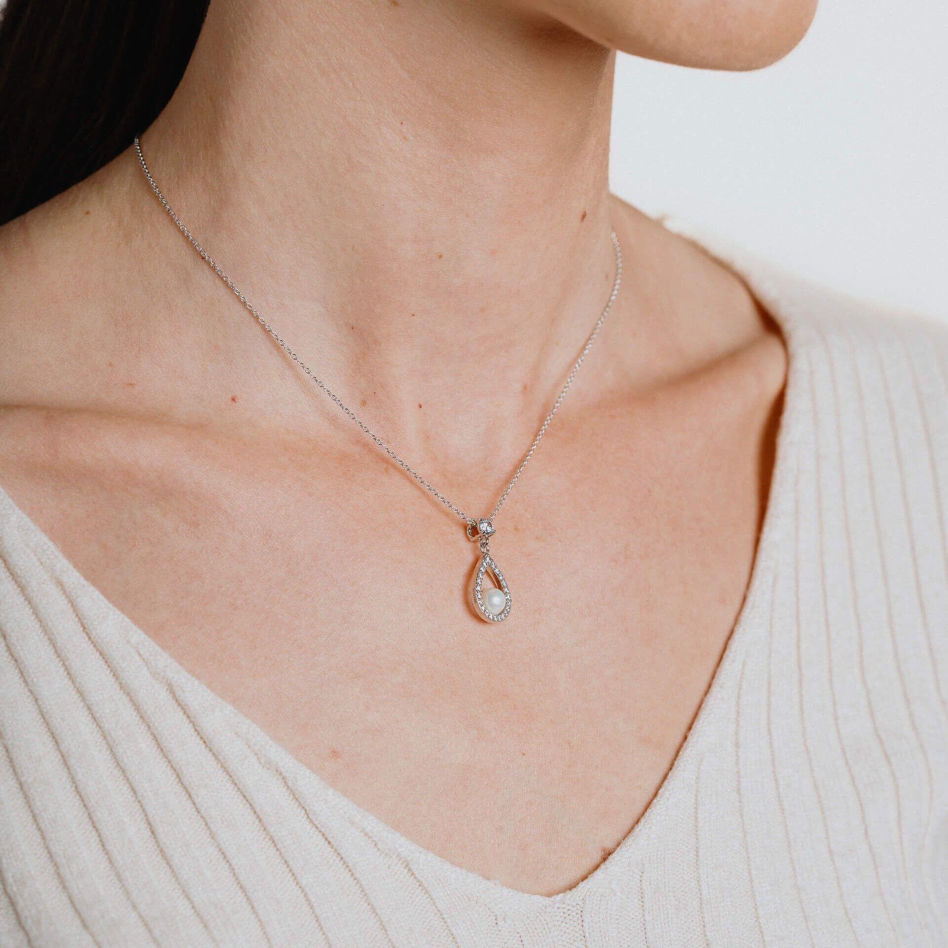 "Diamonfire® Teardrop Pendant with white shell pearl and 0.55ct zirconia, crafted in triple plated sterling silver, 57-facet brilliance, AnchorCert Pro certified skin safe, presented in luxury silk packaging with gift bag—perfect for weddings and elegant occasions."