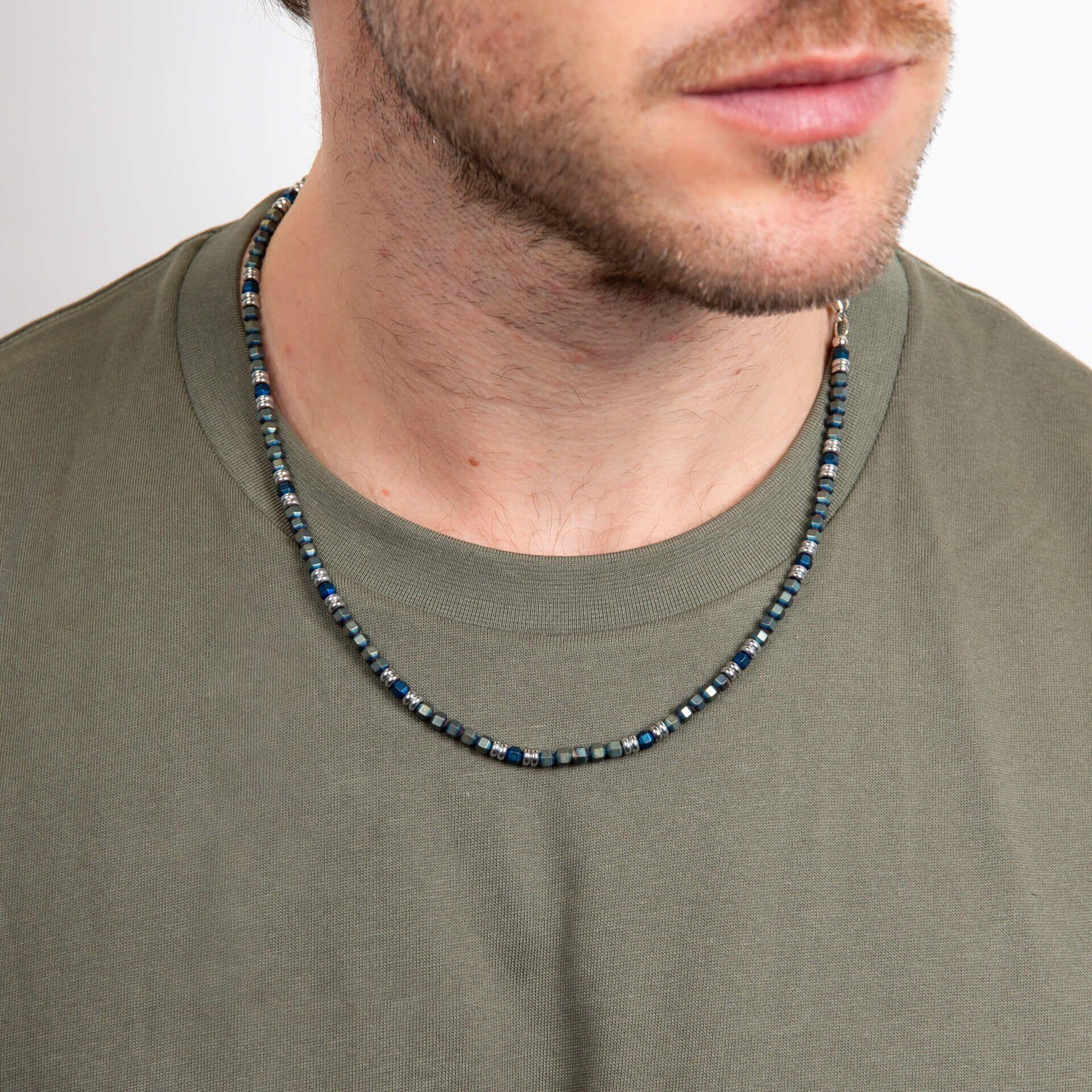 "fredbennett® Blue Hematite Bead Necklace – features natural blue and green hematite beads with stainless steel accents, inspired by nature’s calm and depth. Skin-safe and presented in a suede pouch from Gold and Diamonds."