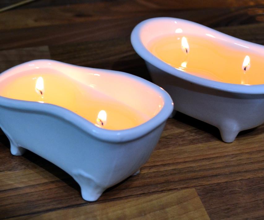 Scented candles in a roll-top bathtub