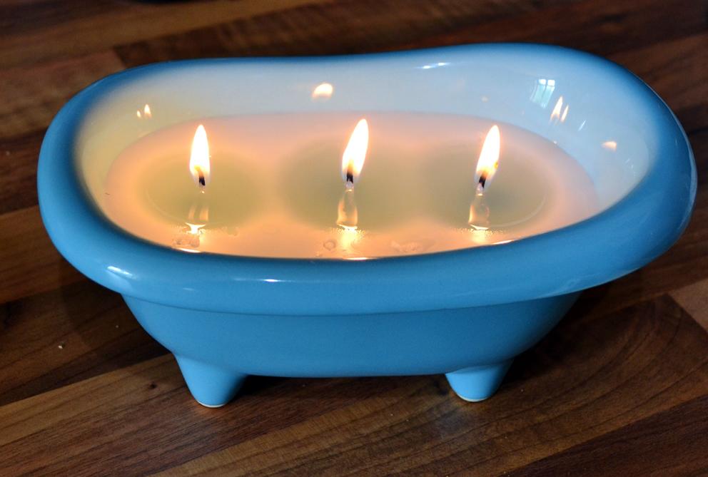 Scented 3-wick candle in a large bathtub