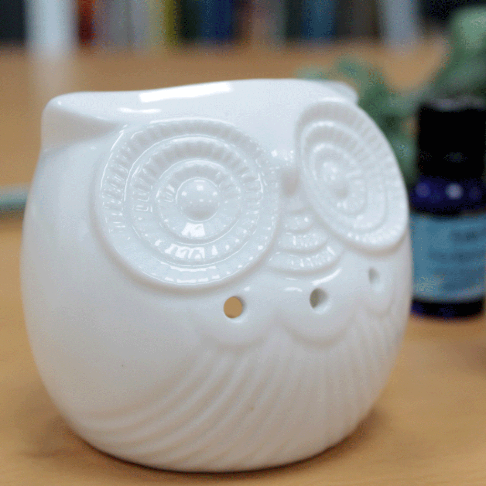 White ceramic owl oil burner