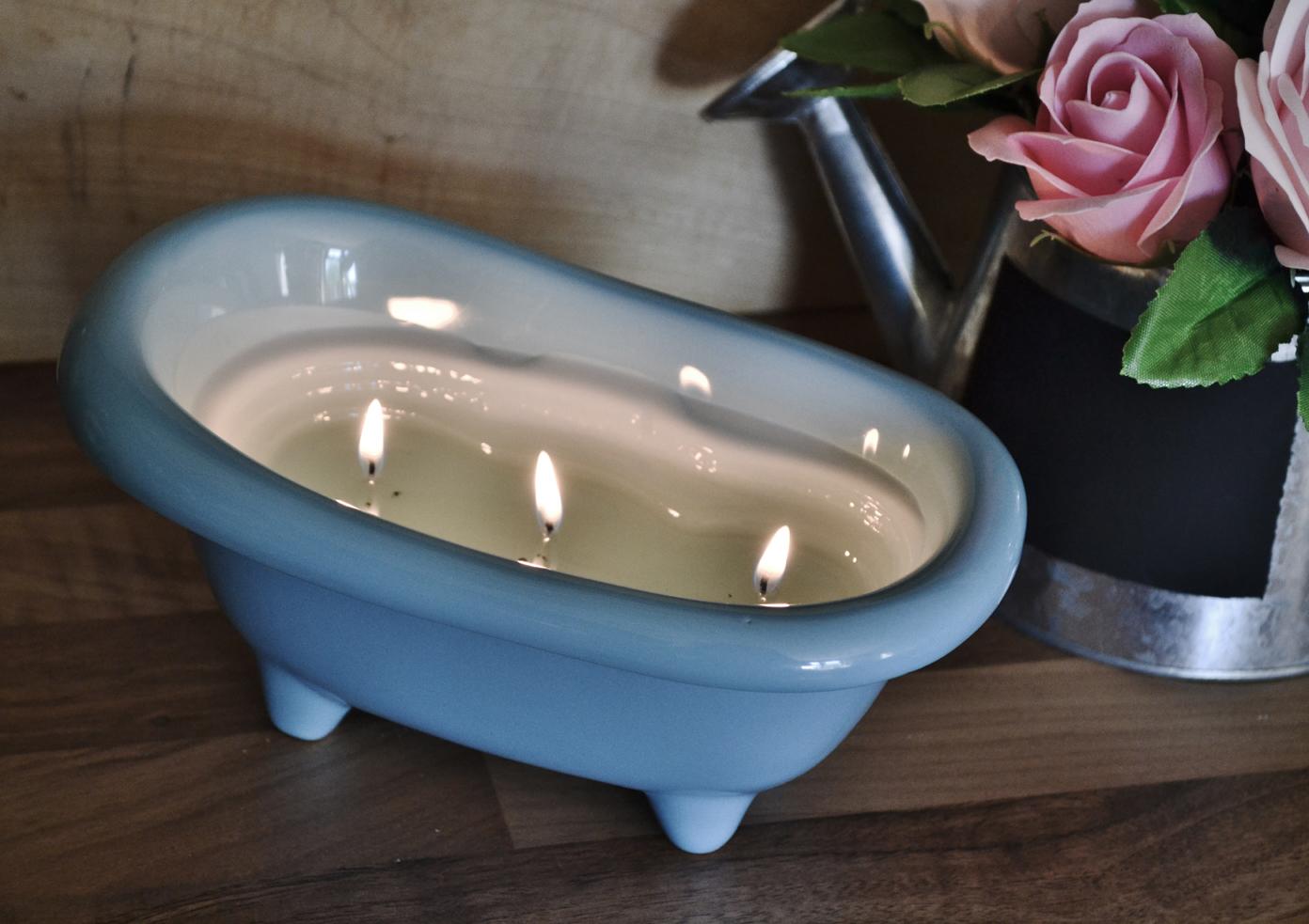 Scented 3-wick candle in a large bathtub