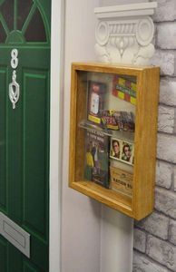 Memory box on wall next to door