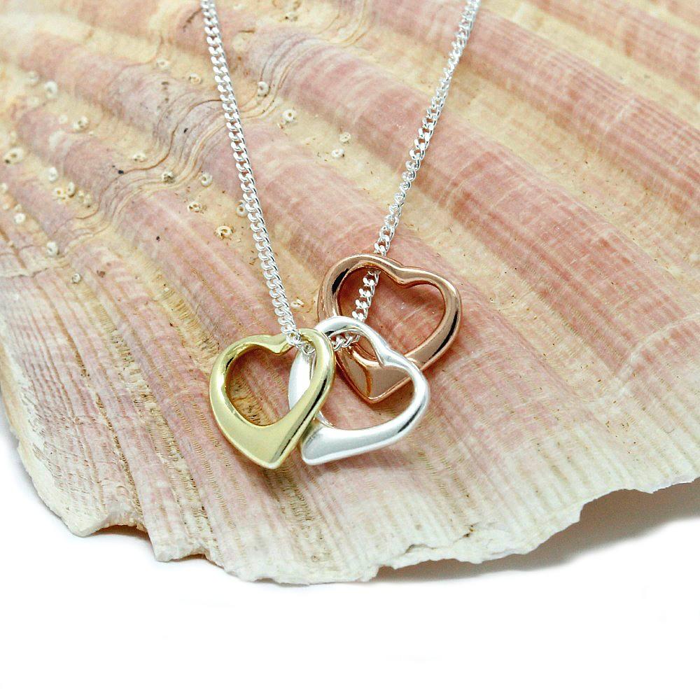 gold, rose gold and silver heart pendant