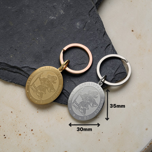 Silver and gold oval Saint Christopher keyrings displayed together – personalised engraved stainless steel keyrings