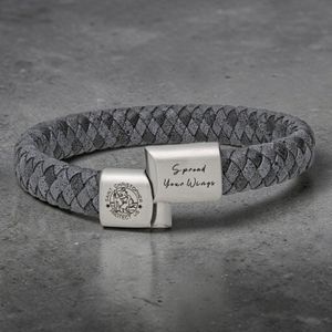 Handmade St Christopher leather bracelet laid flat showing brown leather strap and silver charm