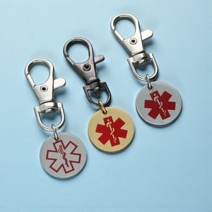 Multiple steel medical alert keyrings with colorful medical symbols and lobster clasp attachments