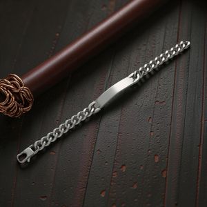 Flat lay of personalised stainless steel ID bracelet in silver finish