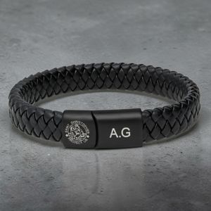 Black leather St Christopher safe travels bracelet outside view showing braided detail