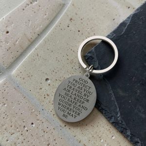 Large silver stainless steel oval Saint Christopher keyring with personalised engraving – custom engraved keyring