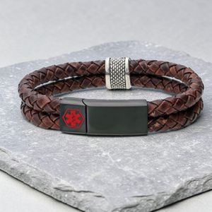 Leather medical alert bracelet sample engraving example showing name condition and emergency contact on stainless steel clasp