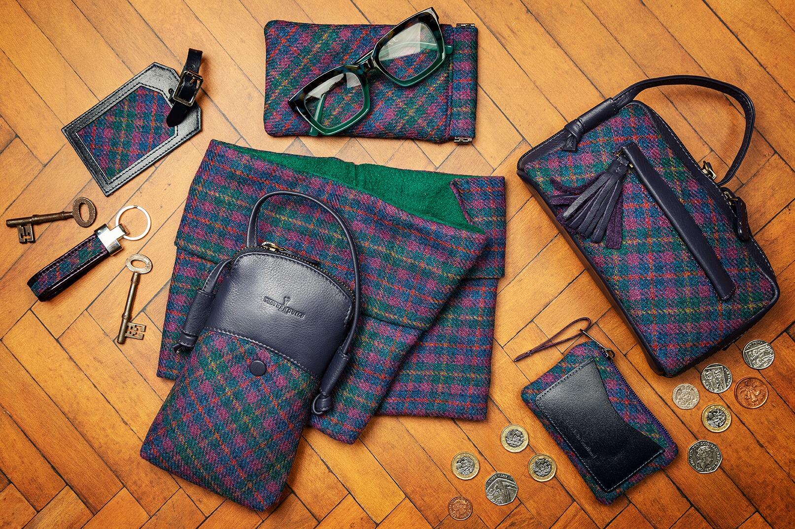Moorland tweed with deep blue leather featuring Cleo bag and Buzz bag with matching accessories.