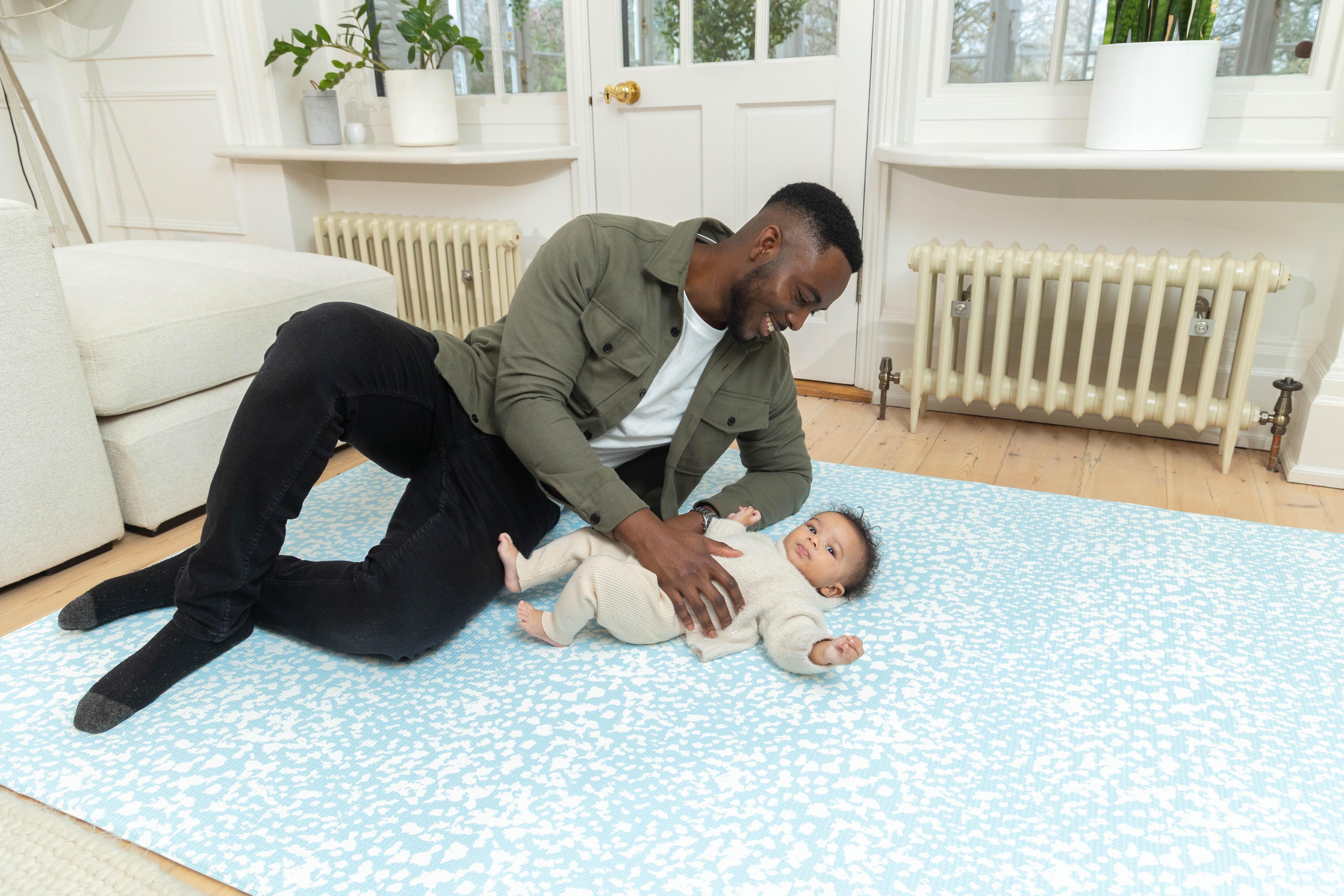 Close-up of Chalk Blue Speckled Kisses surface – gentle matte texture on eco-friendly cushioned foam baby playmat