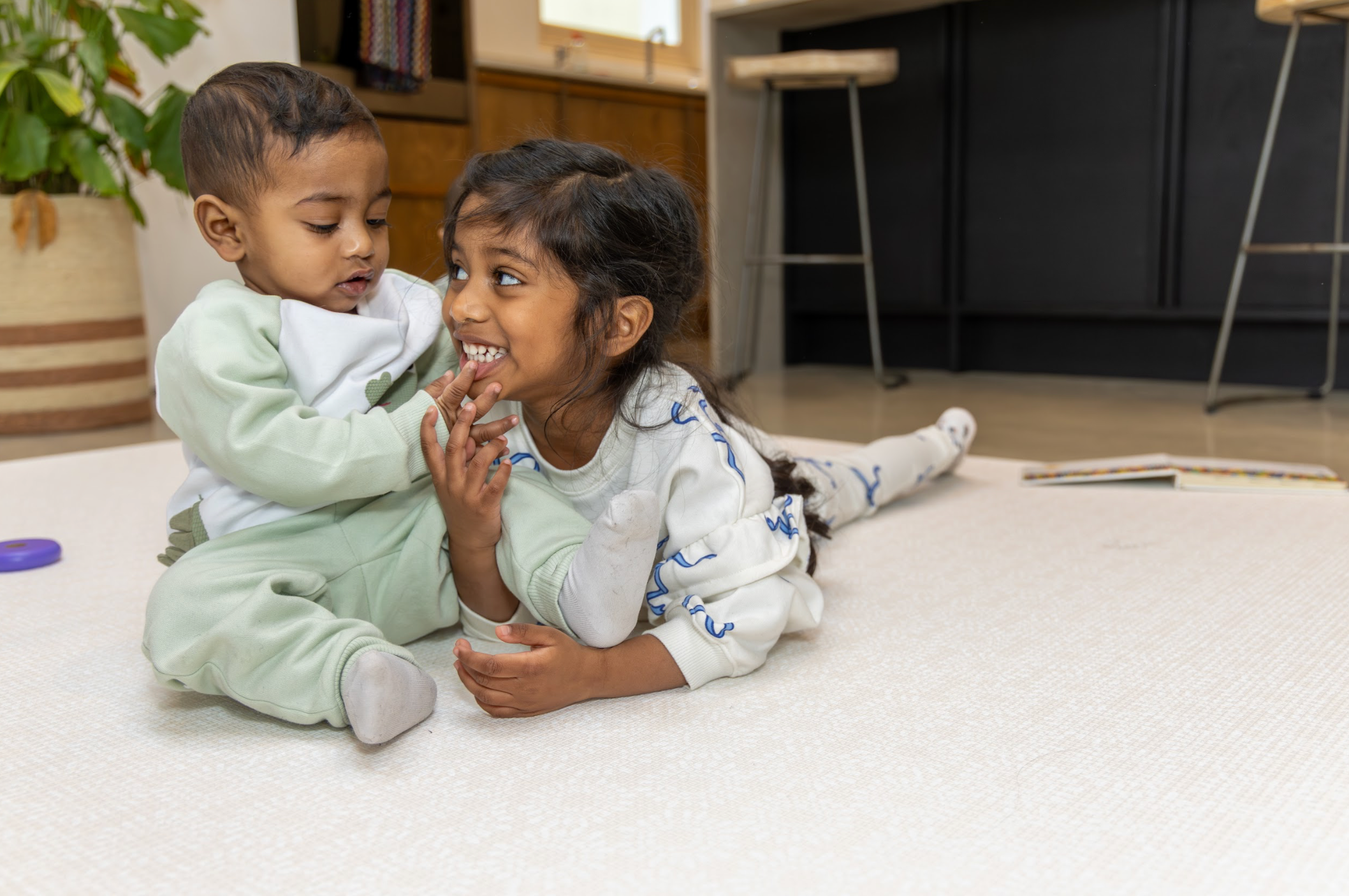 Siblings Playing on Little Fae Playmat Solana in Clay