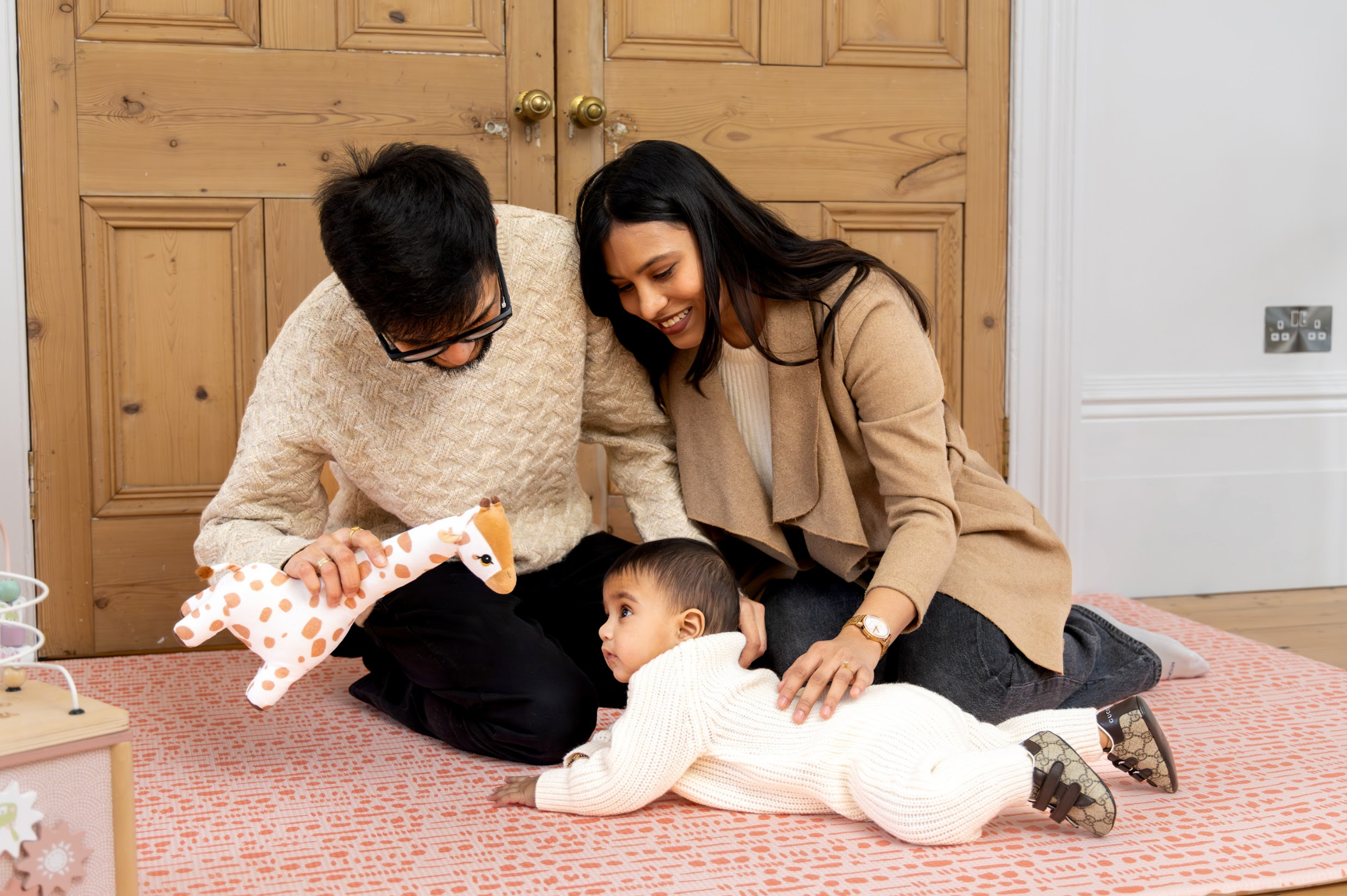 Family together playing on Little Fae Playmat