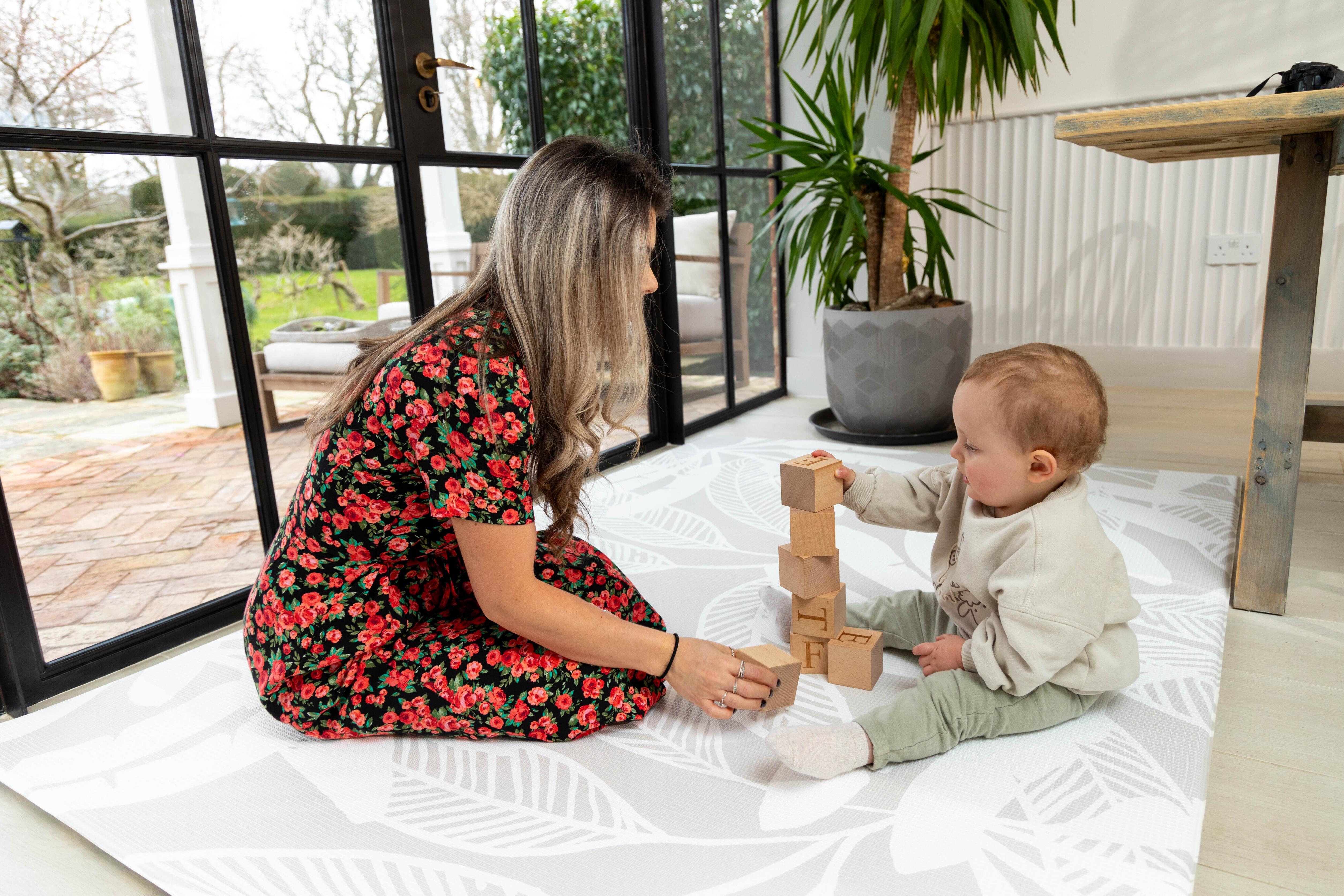 Large Baby Playmat – Bare Palms Scandi design providing cushioned comfort and elegant simplicity.