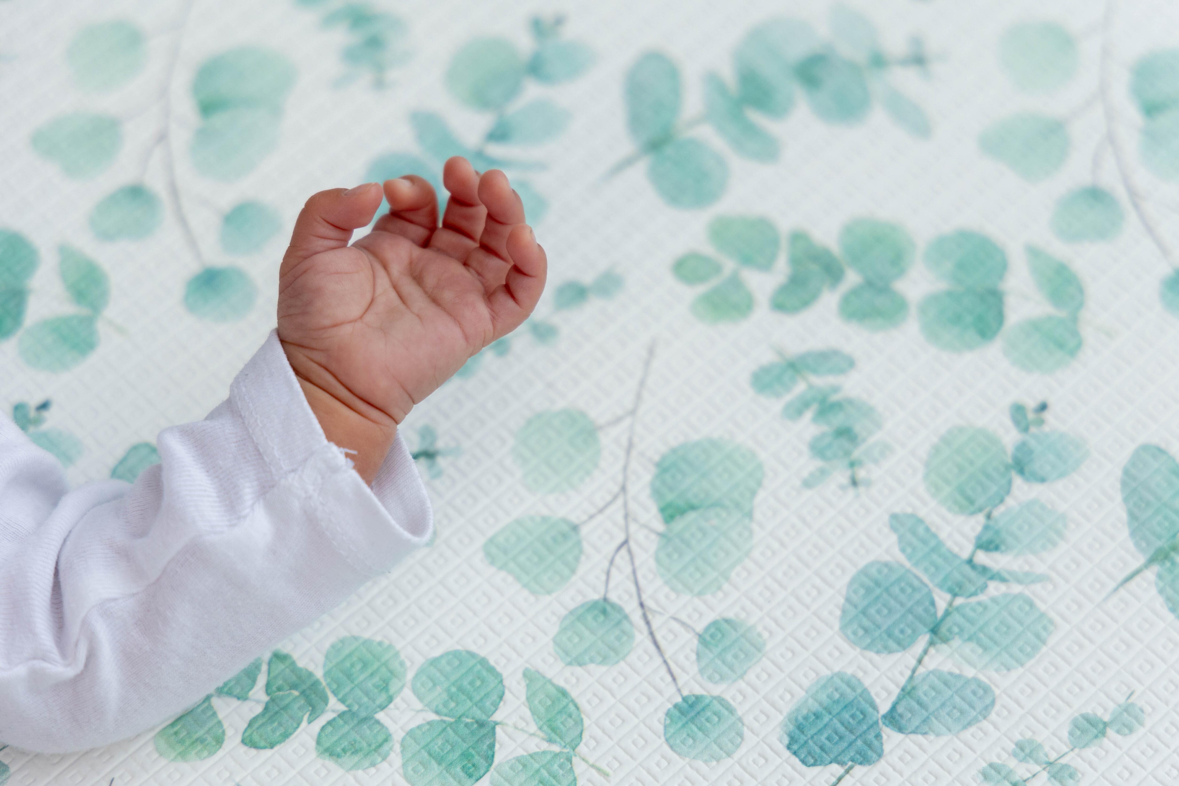 Close-up of Botanical Green surface – wipe-clean non-toxic cushioned foam playmat with soft matte finish by Little Fae